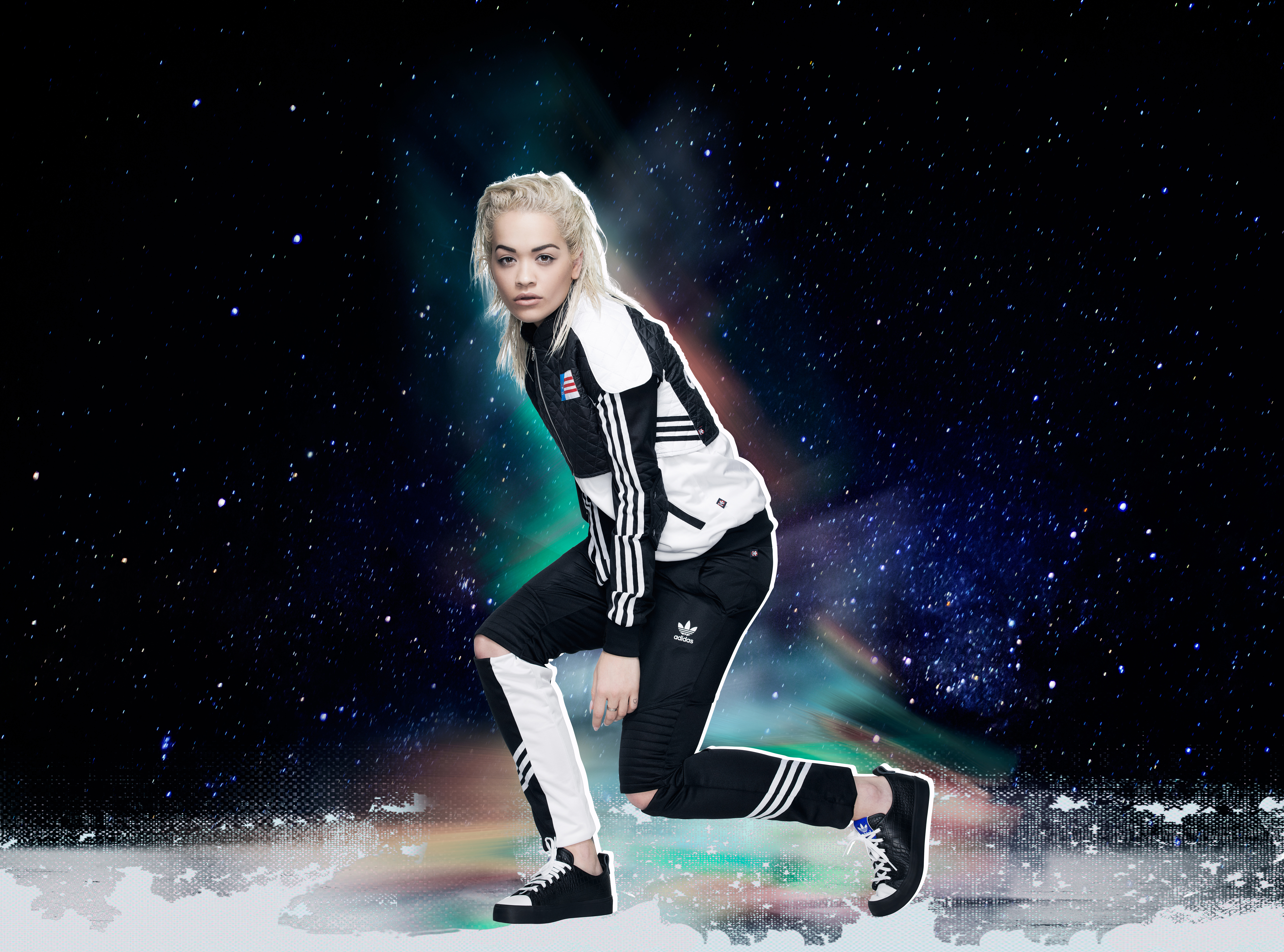 Rita Ora in Adidas tracksuit against starry background HD Wallpaper