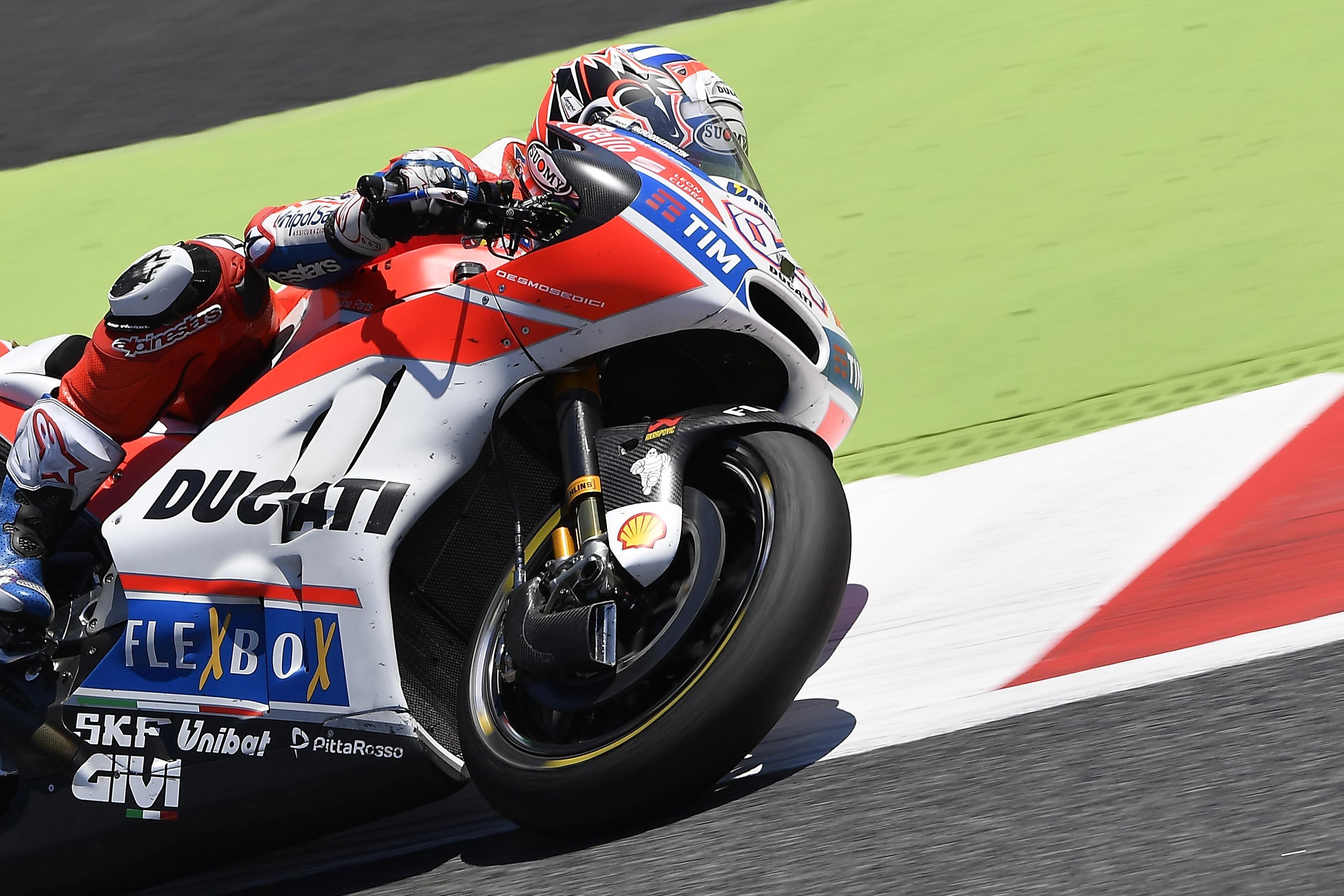 Andrea Dovizioso on a Ducati MotoGP motorcycle HD Wallpaper