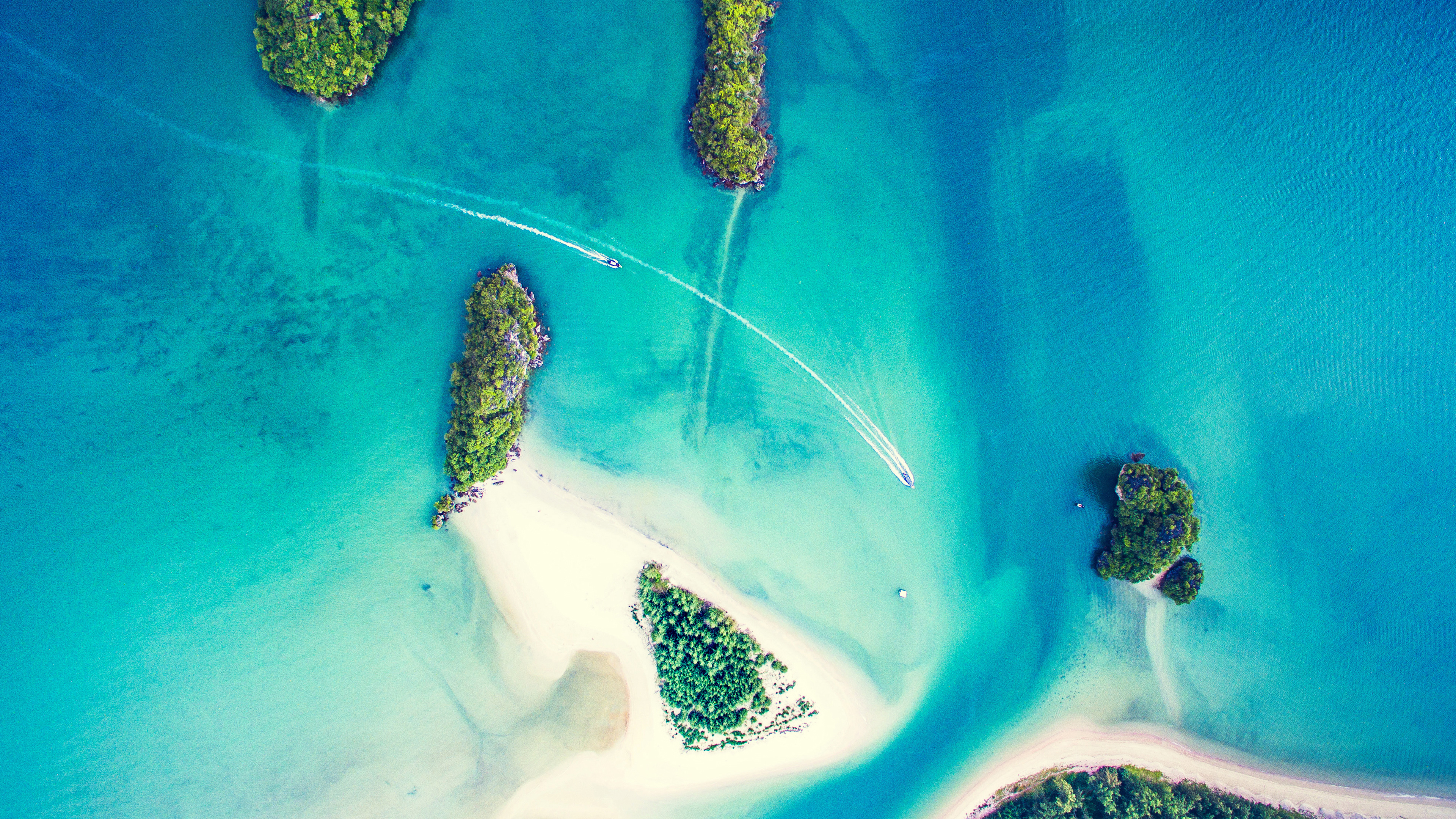 Aerial view of tropical islands and boats in turquoise water HD Wallpaper