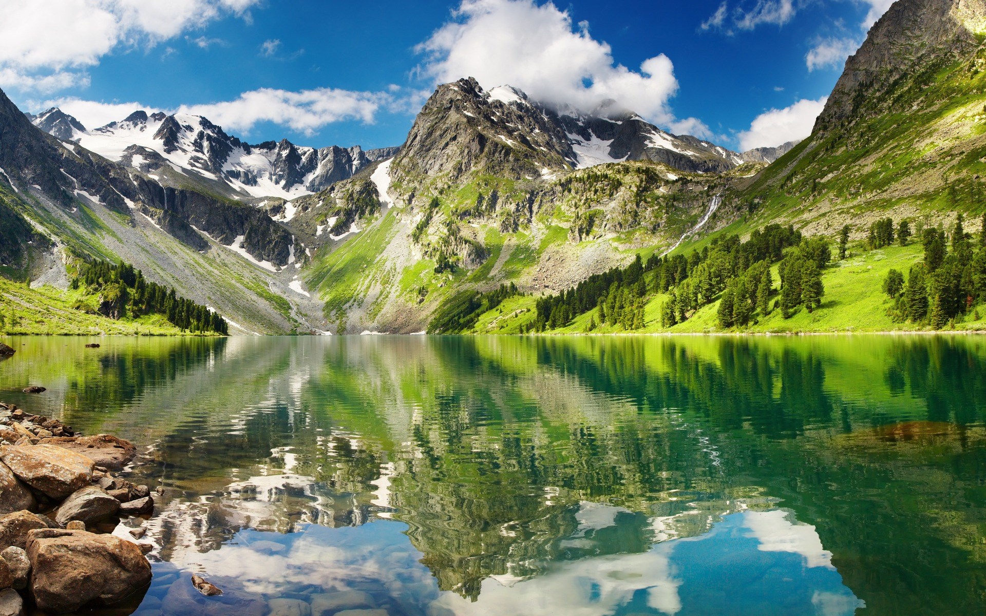Mountain lake with reflections and rocky shore HD Wallpaper