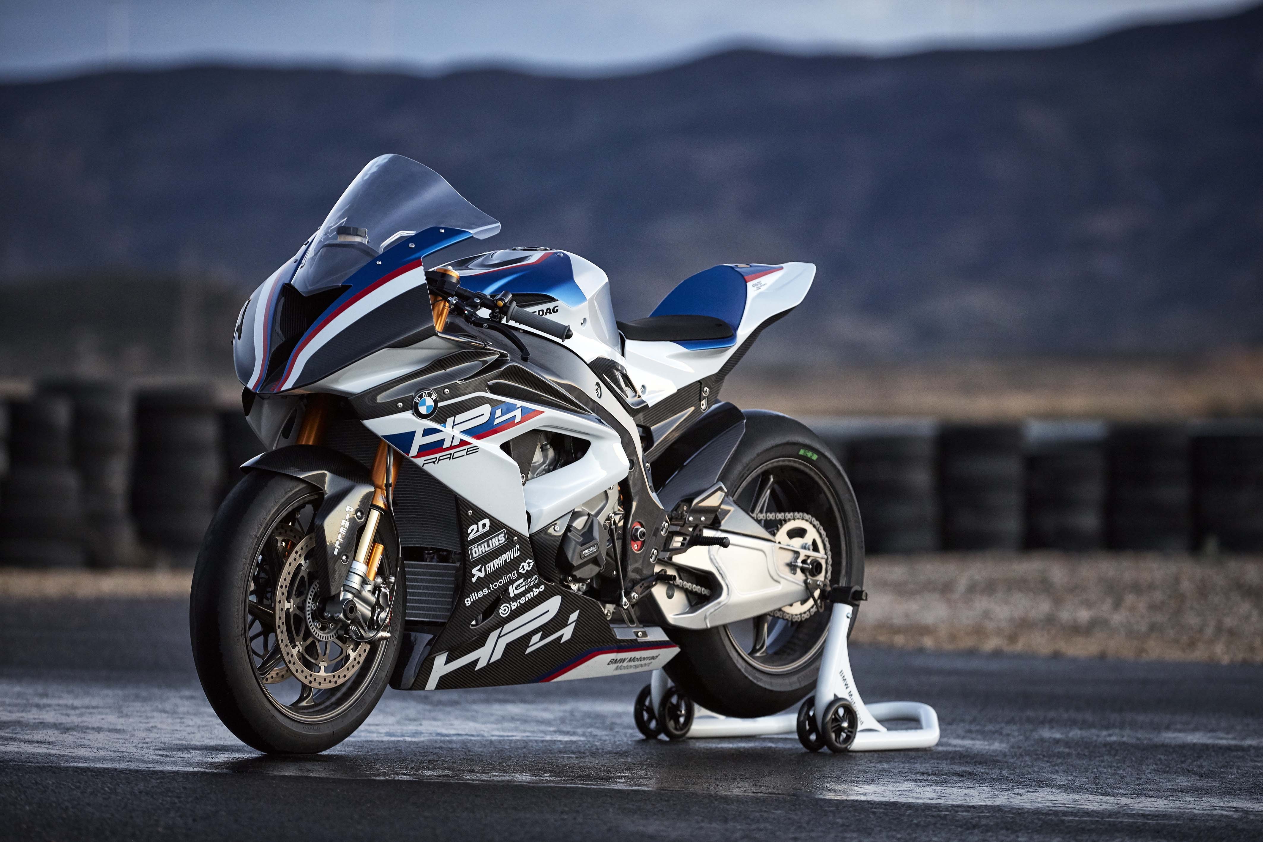 BMW HP4 Race motorcycle on a track HD Wallpaper