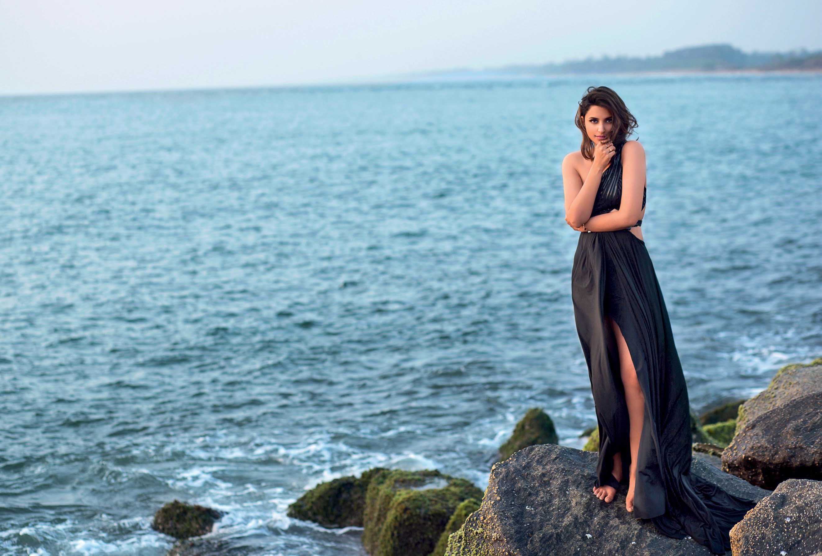 Parineeti Chopra on rocks by the sea HD Wallpaper