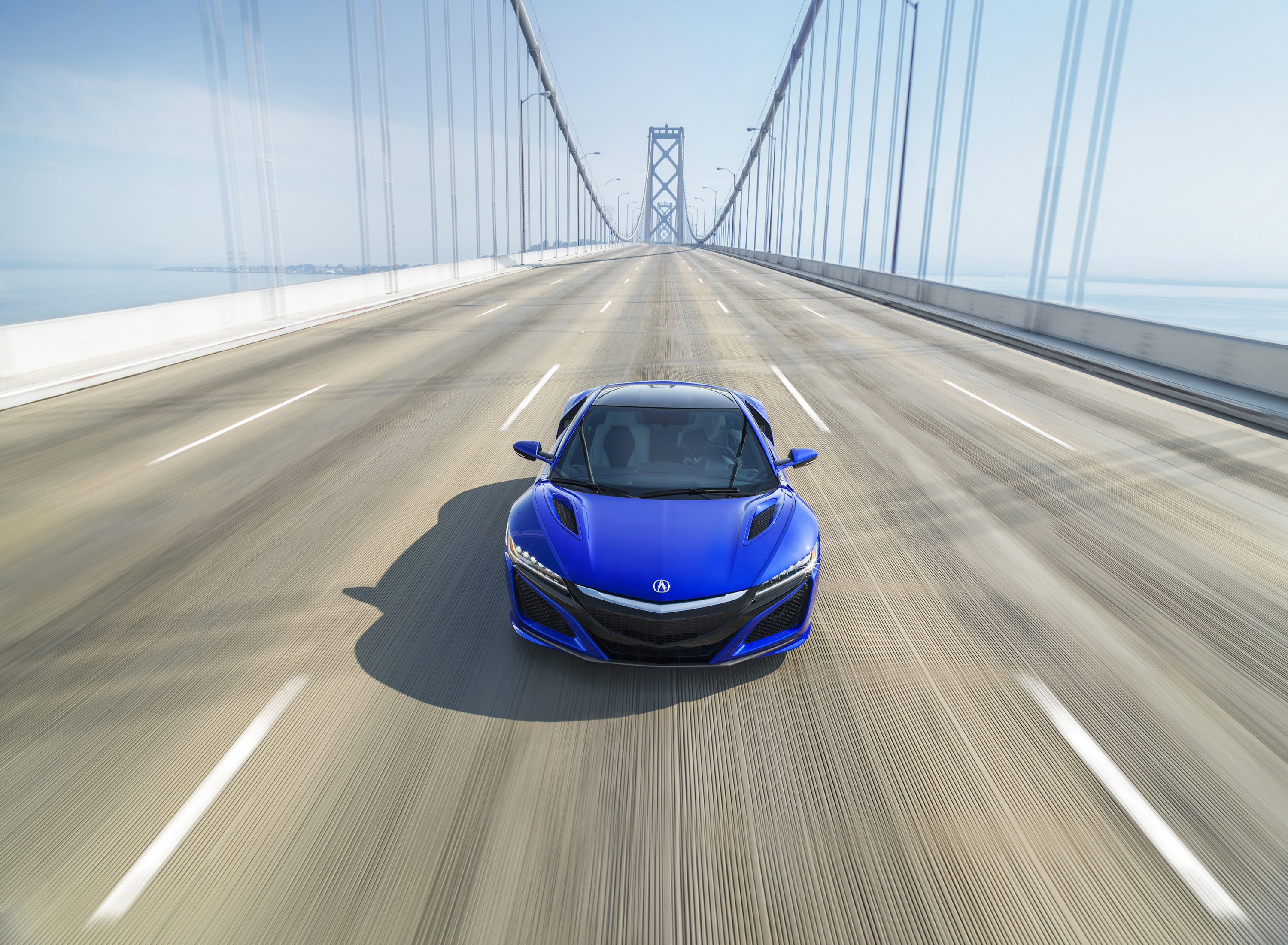 Blue 2017 Acura NSX driving on a bridge HD Wallpaper
