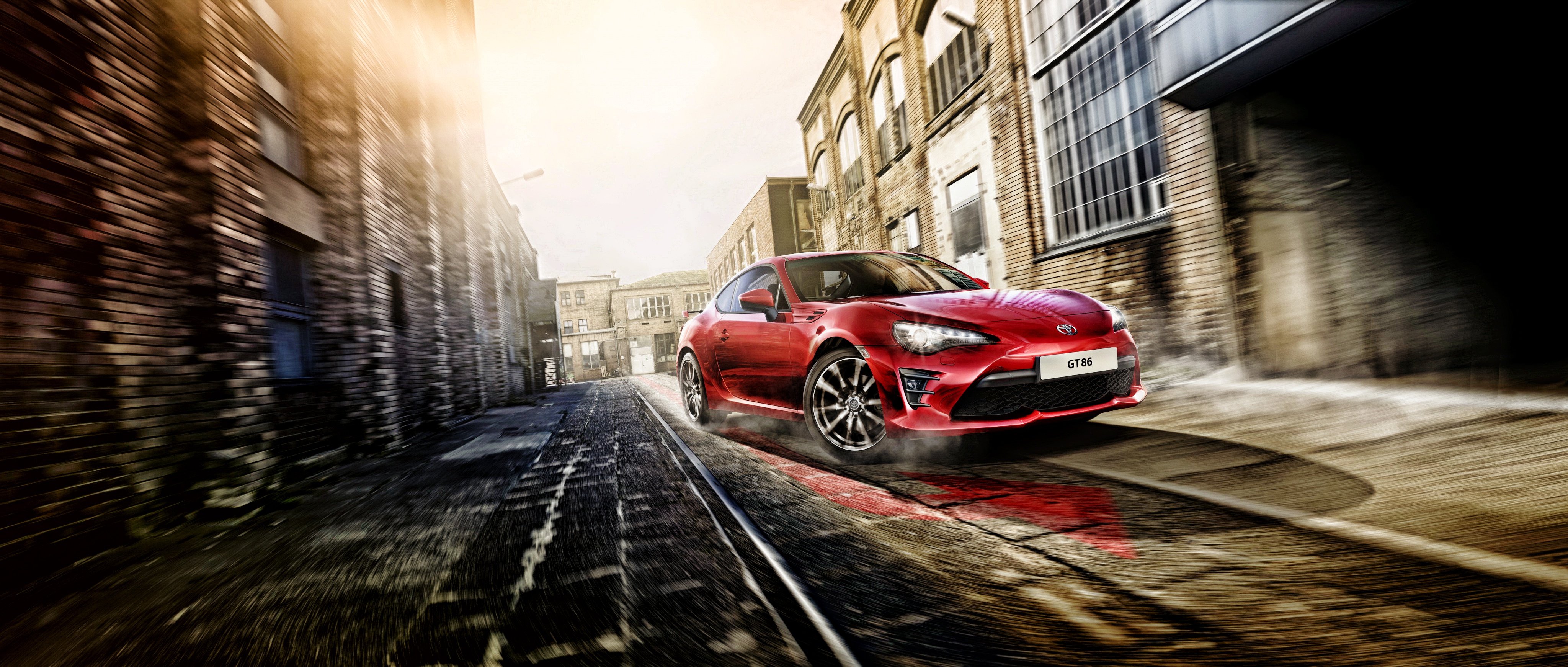 Red Toyota GT86 driving on train tracks HD Wallpaper