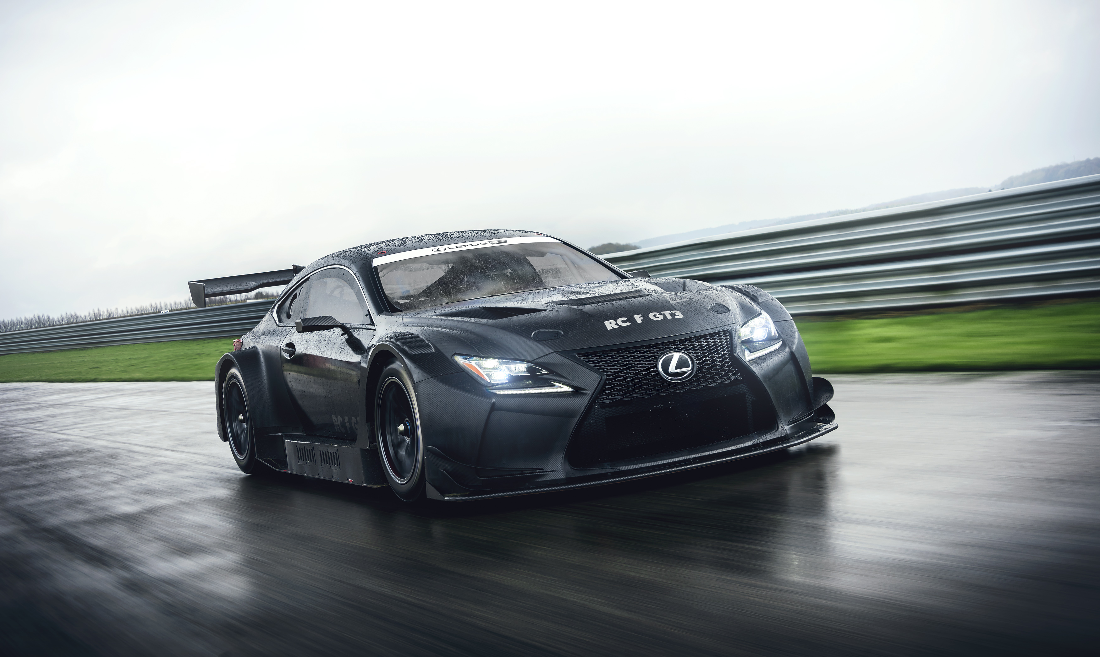 Lexus RC F GT3 race car on a wet track HD Wallpaper