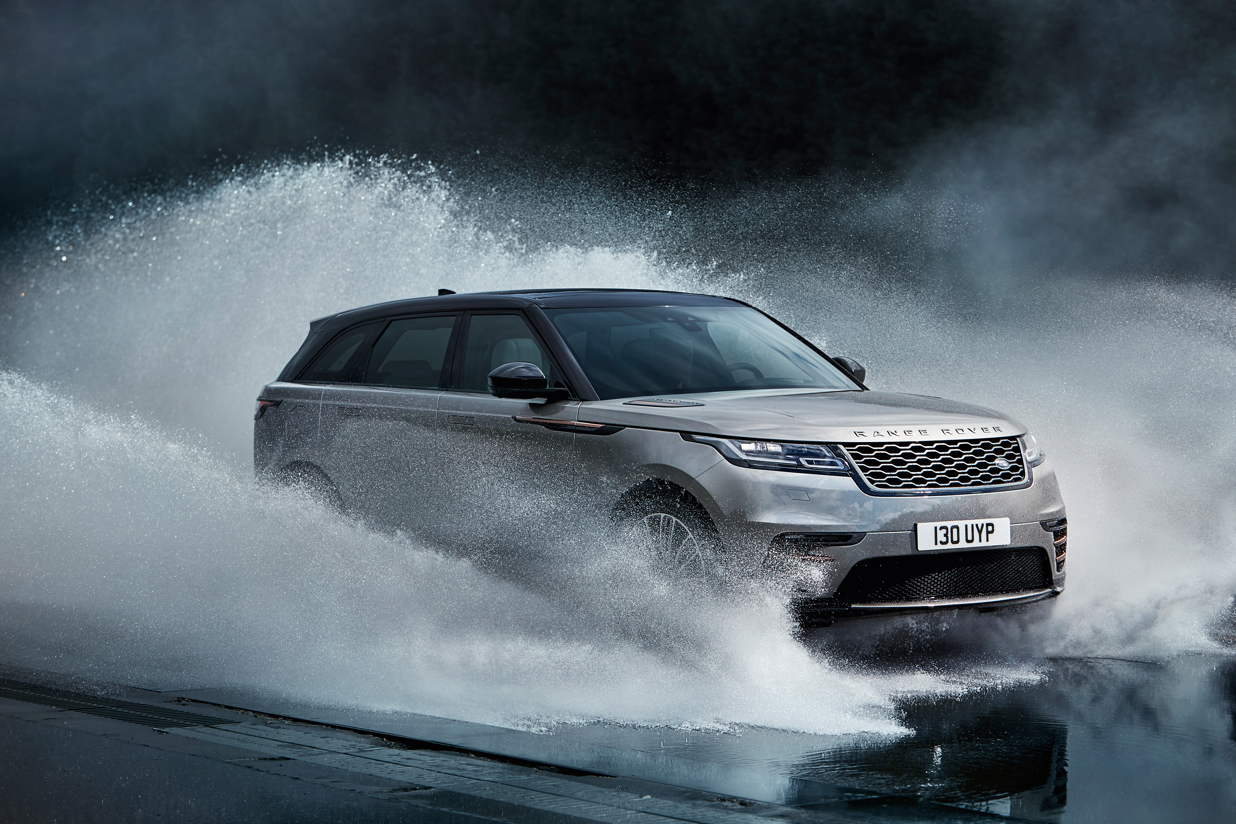 Range Rover Velar driving through water HD Wallpaper