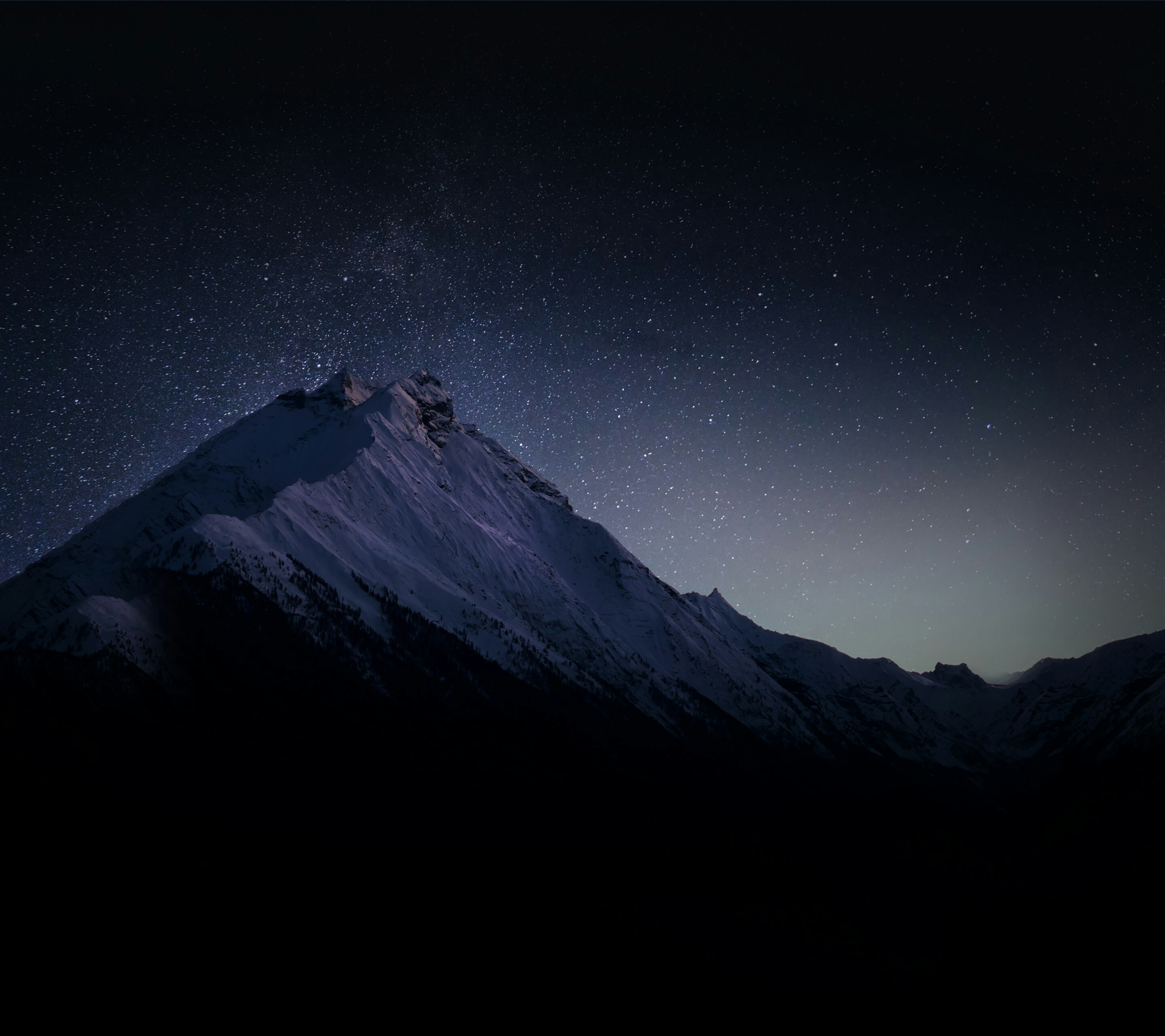 Snowy mountains under a starry night sky HD Wallpaper