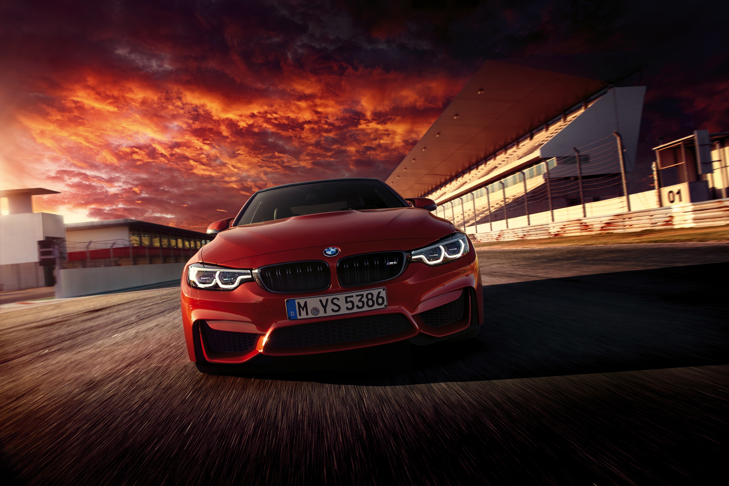 Red 2018 BMW M4 on a Race Track HD Wallpaper
