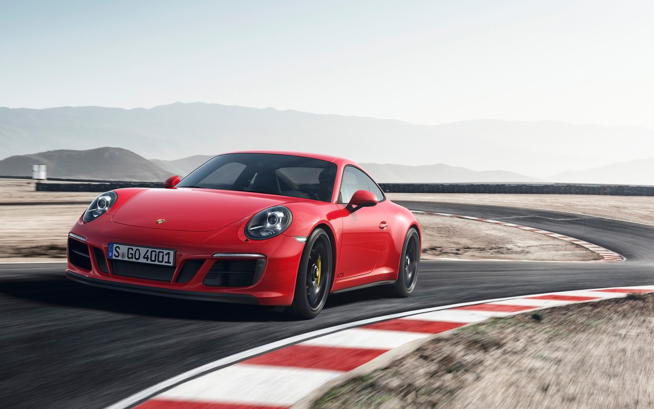 Red 2017 Porsche 911 Carrera GTS on a Racetrack HD Wallpaper