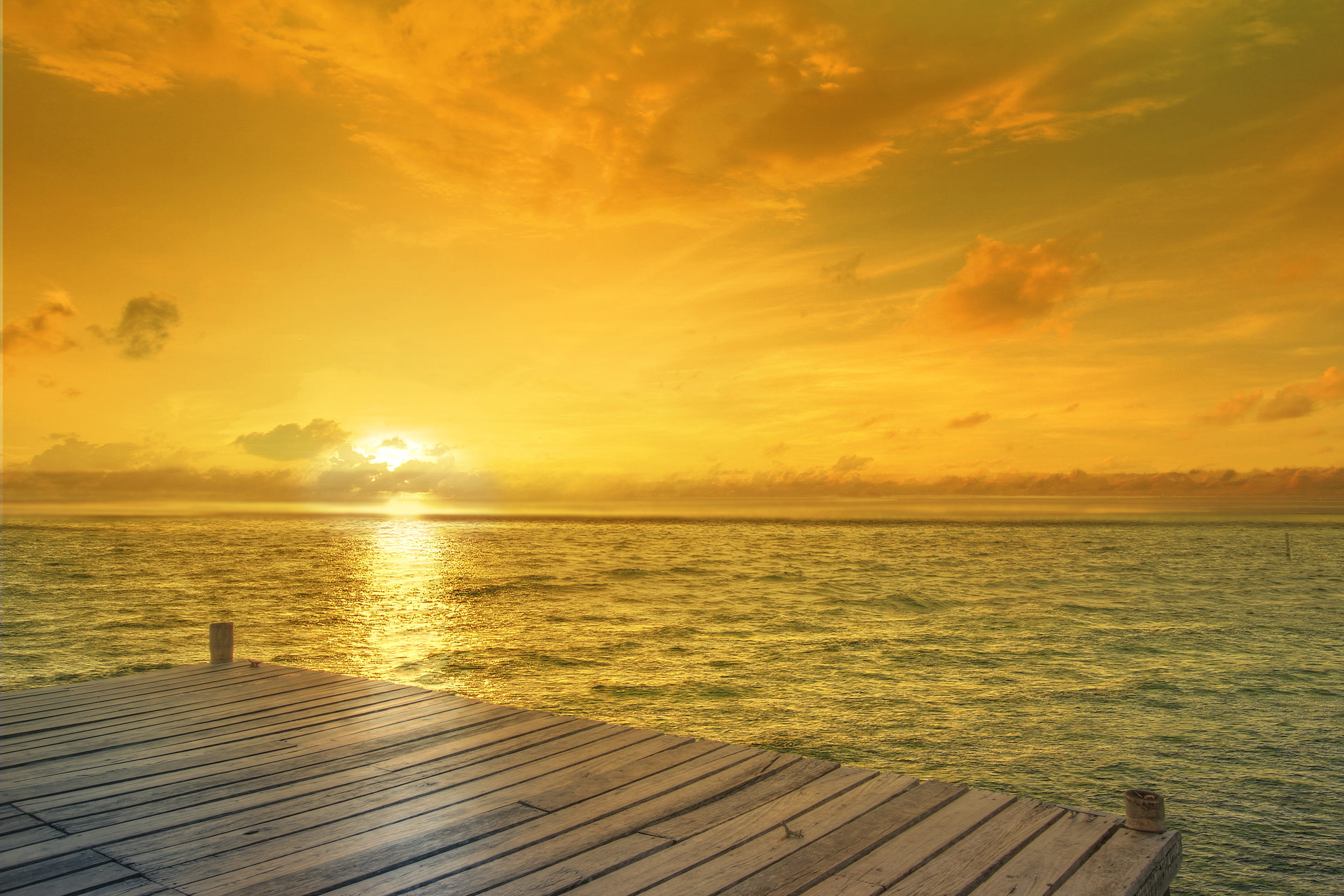 Wooden pier at sunrise over the ocean HD Wallpaper