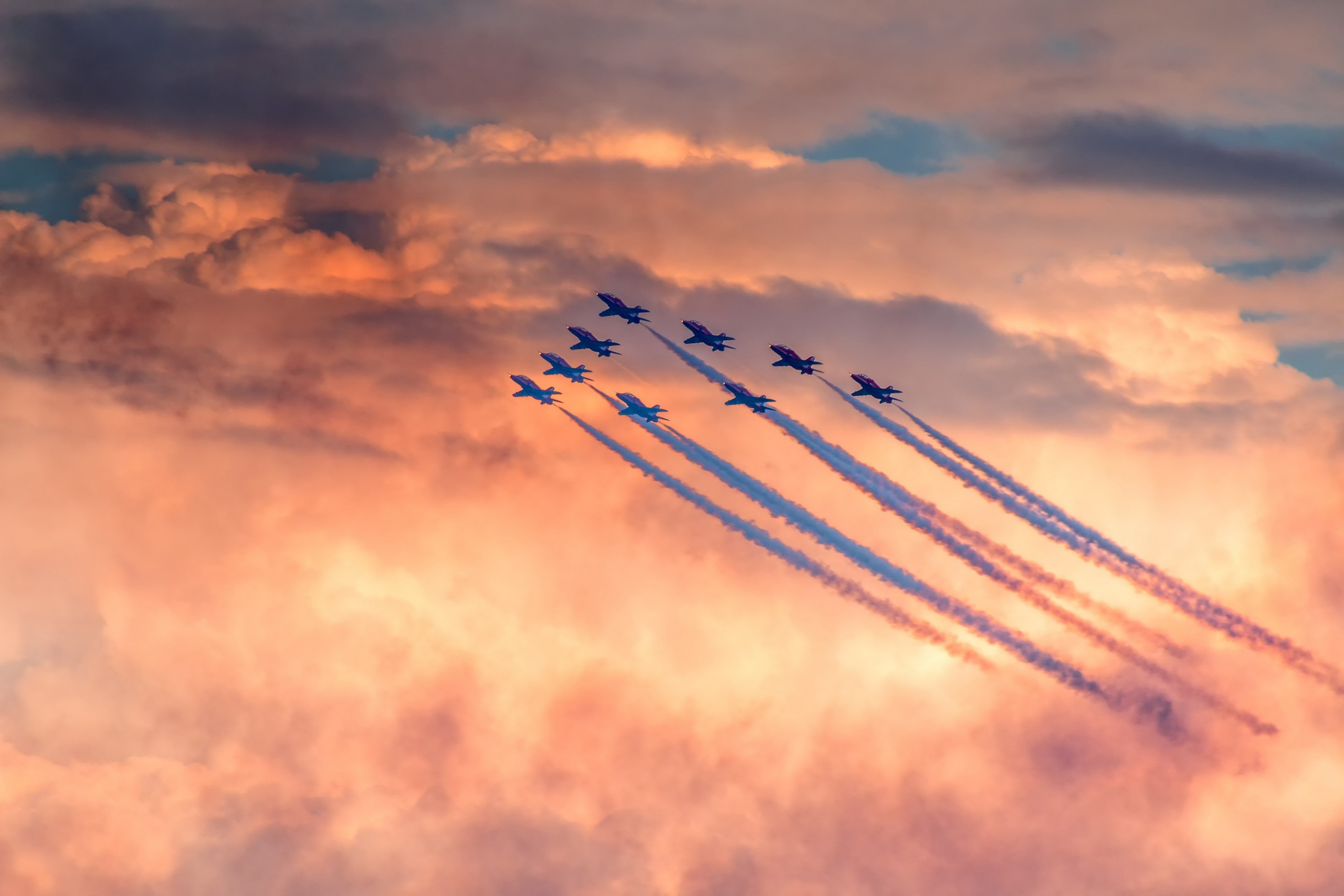 Air show with planes flying in formation HD Wallpaper