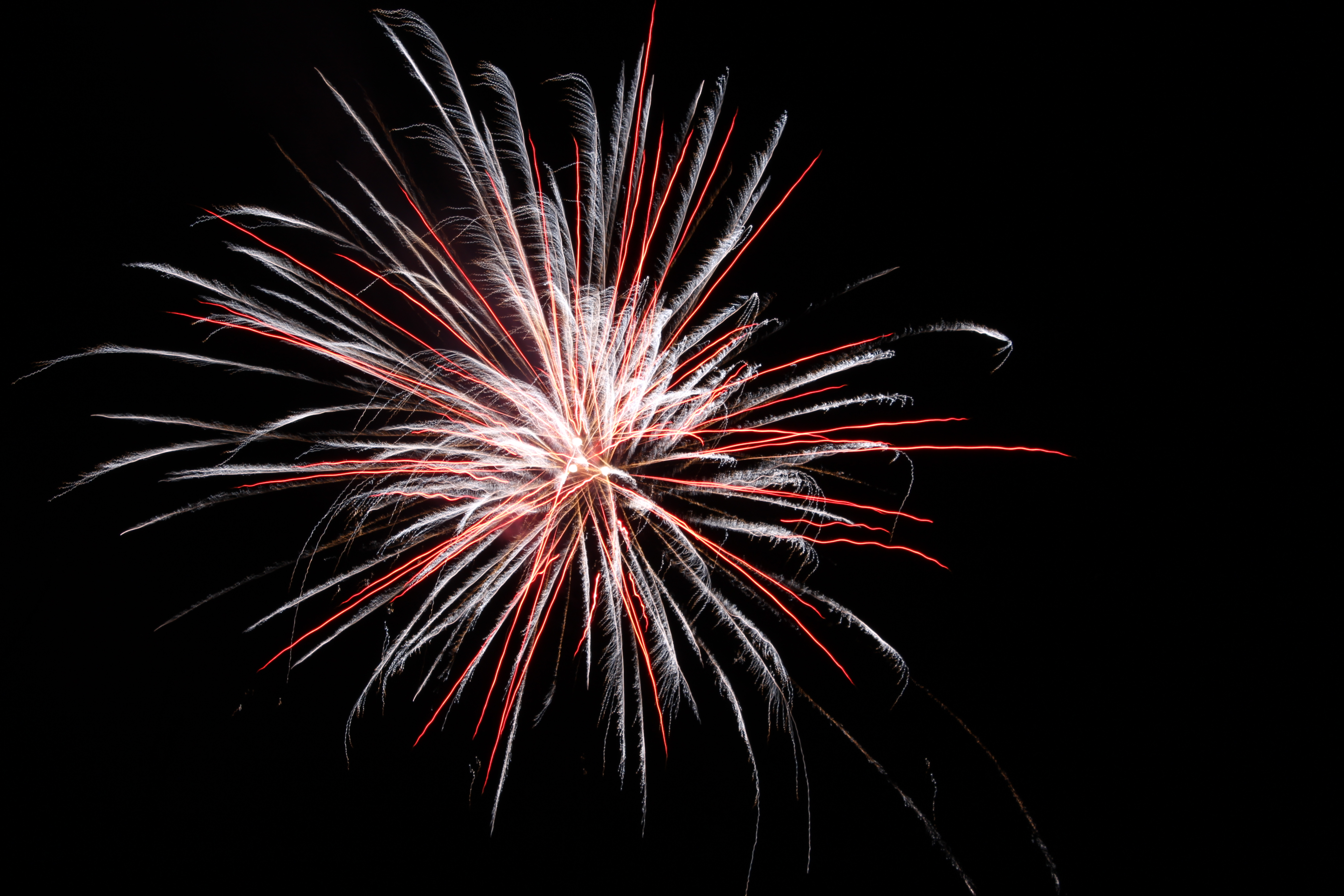 Red and white fireworks exploding in the night sky HD Wallpaper