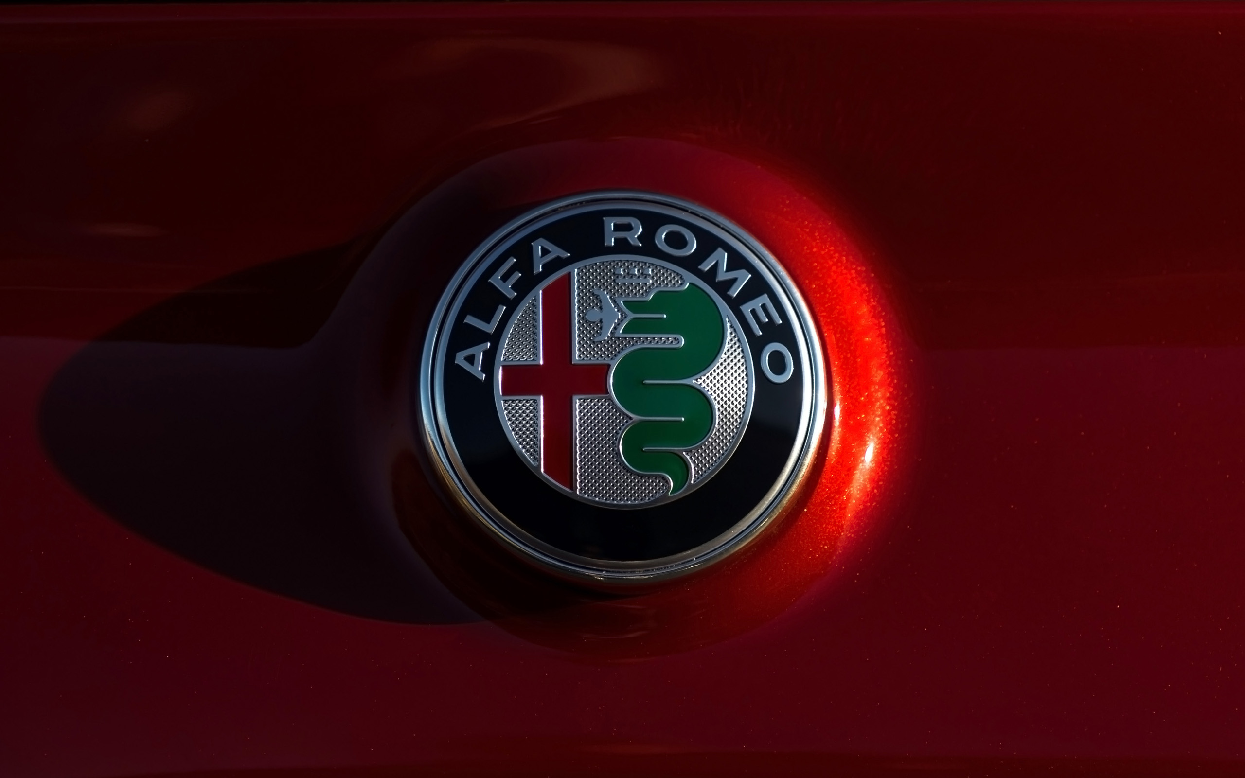 Alfa Romeo logo on a red car HD Wallpaper