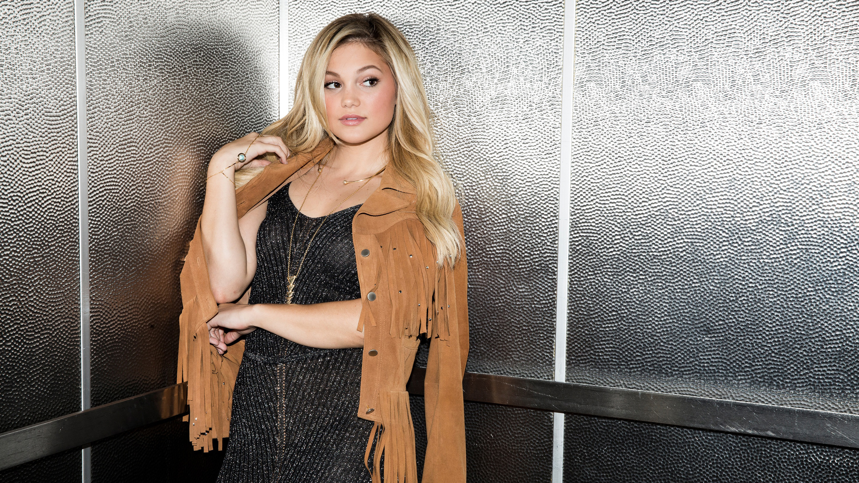 Olivia Holt in a Fringed Jacket HD Wallpaper