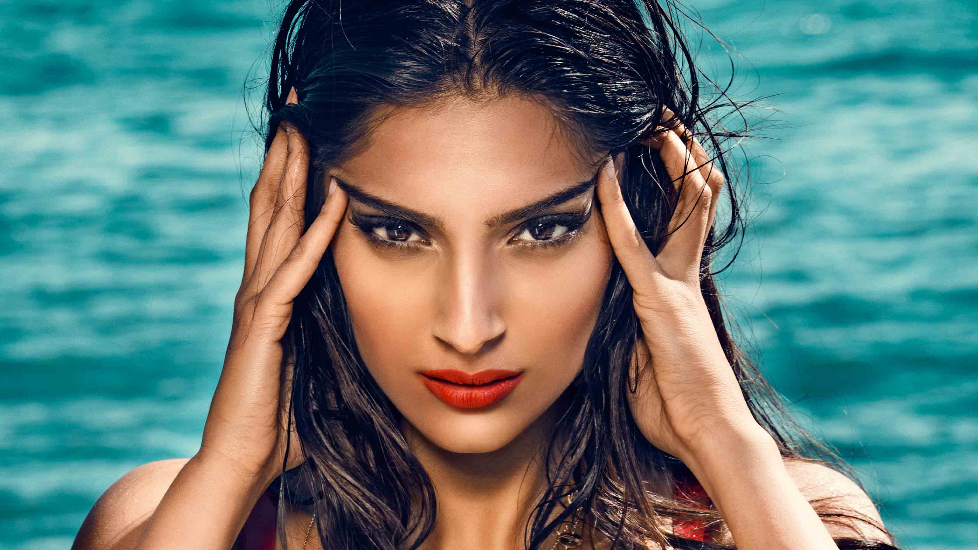 Sonam Kapoor posing with hands on temples HD Wallpaper