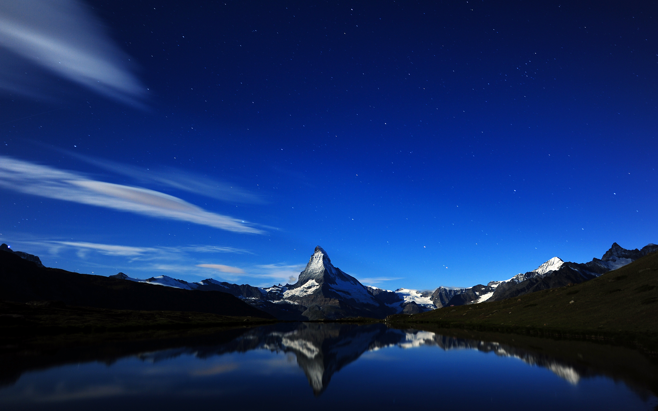 Matterhorn mountain reflected in a lake at night HD Wallpaper