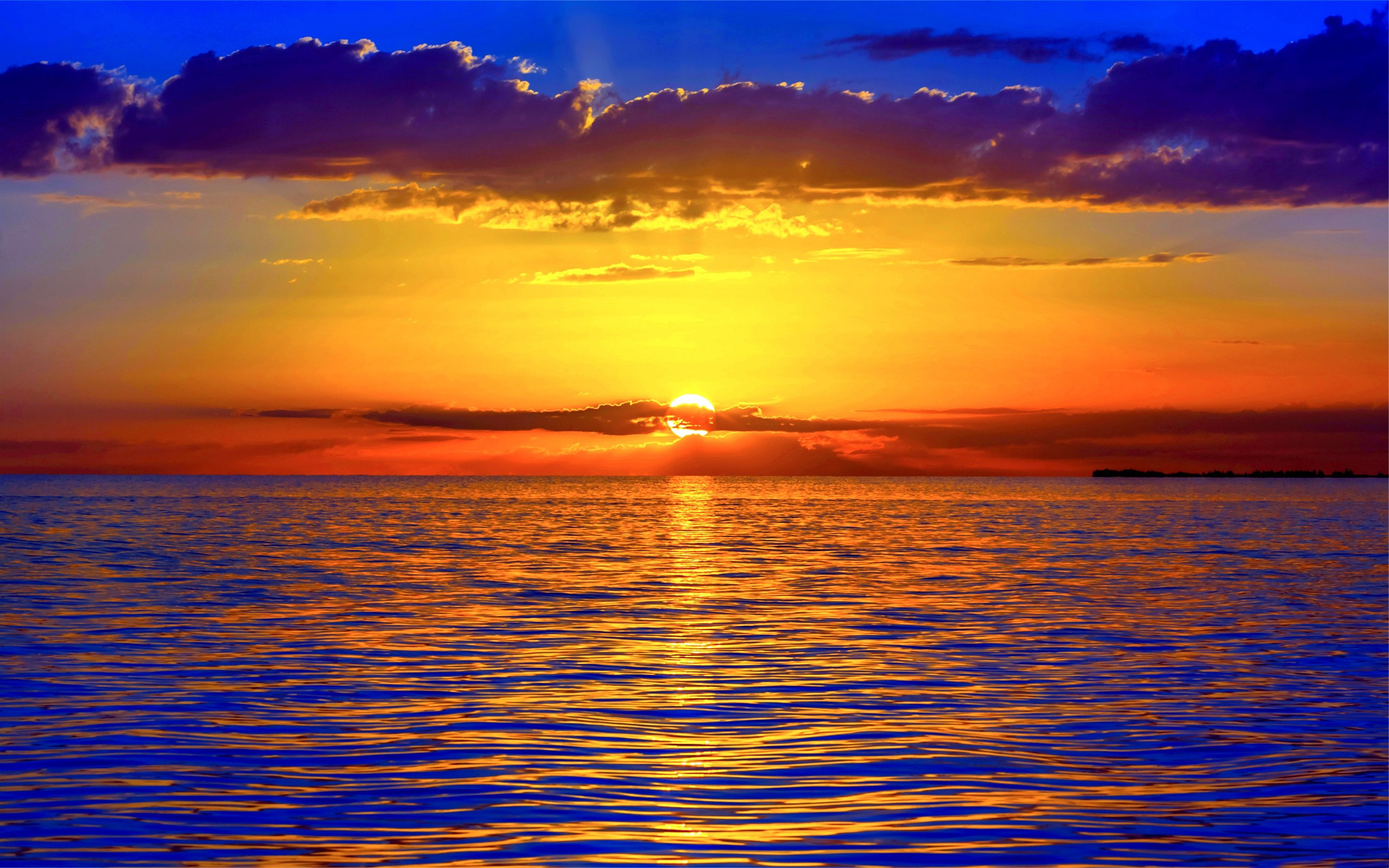Sunset over the ocean with colorful clouds HD Wallpaper