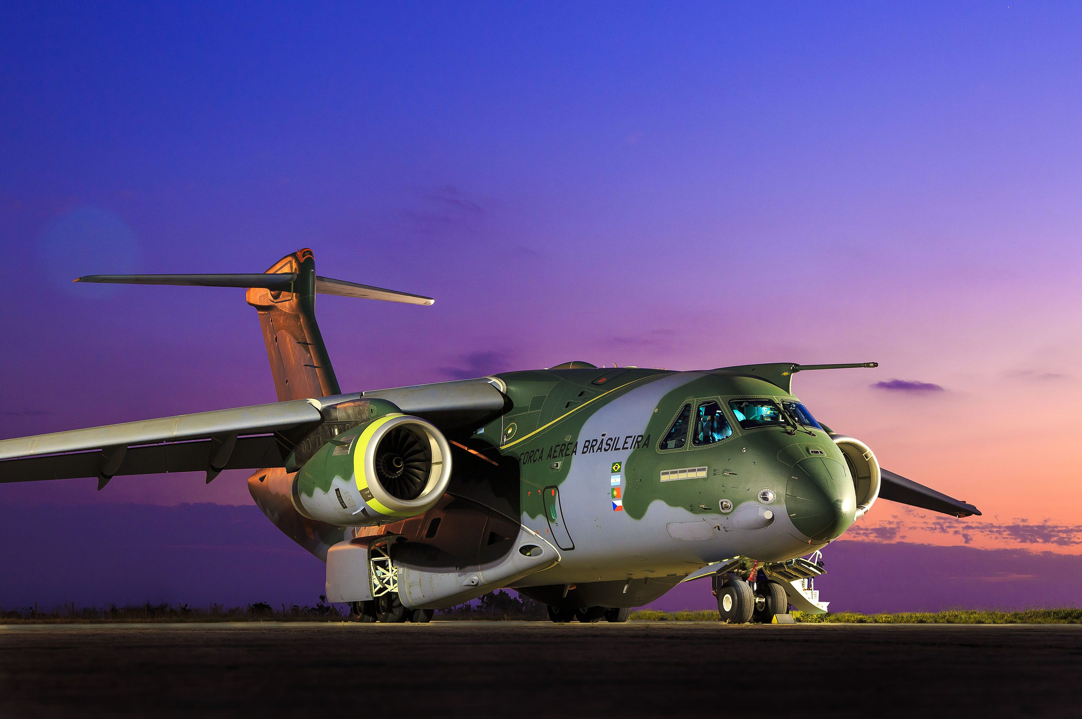 Embraer KC-390 transport aircraft at dusk HD Wallpaper