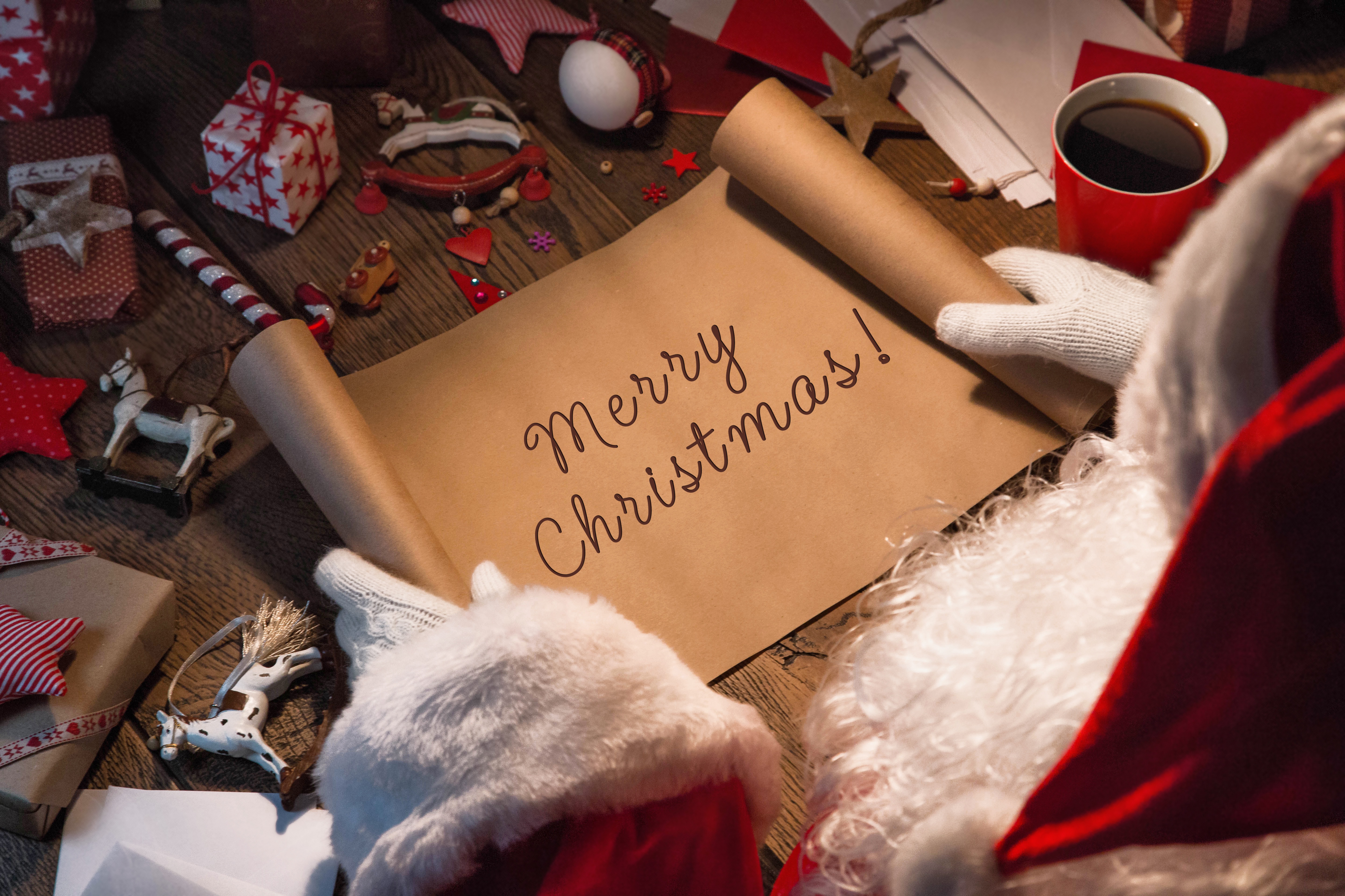 Santa Claus with Merry Christmas scroll HD Wallpaper