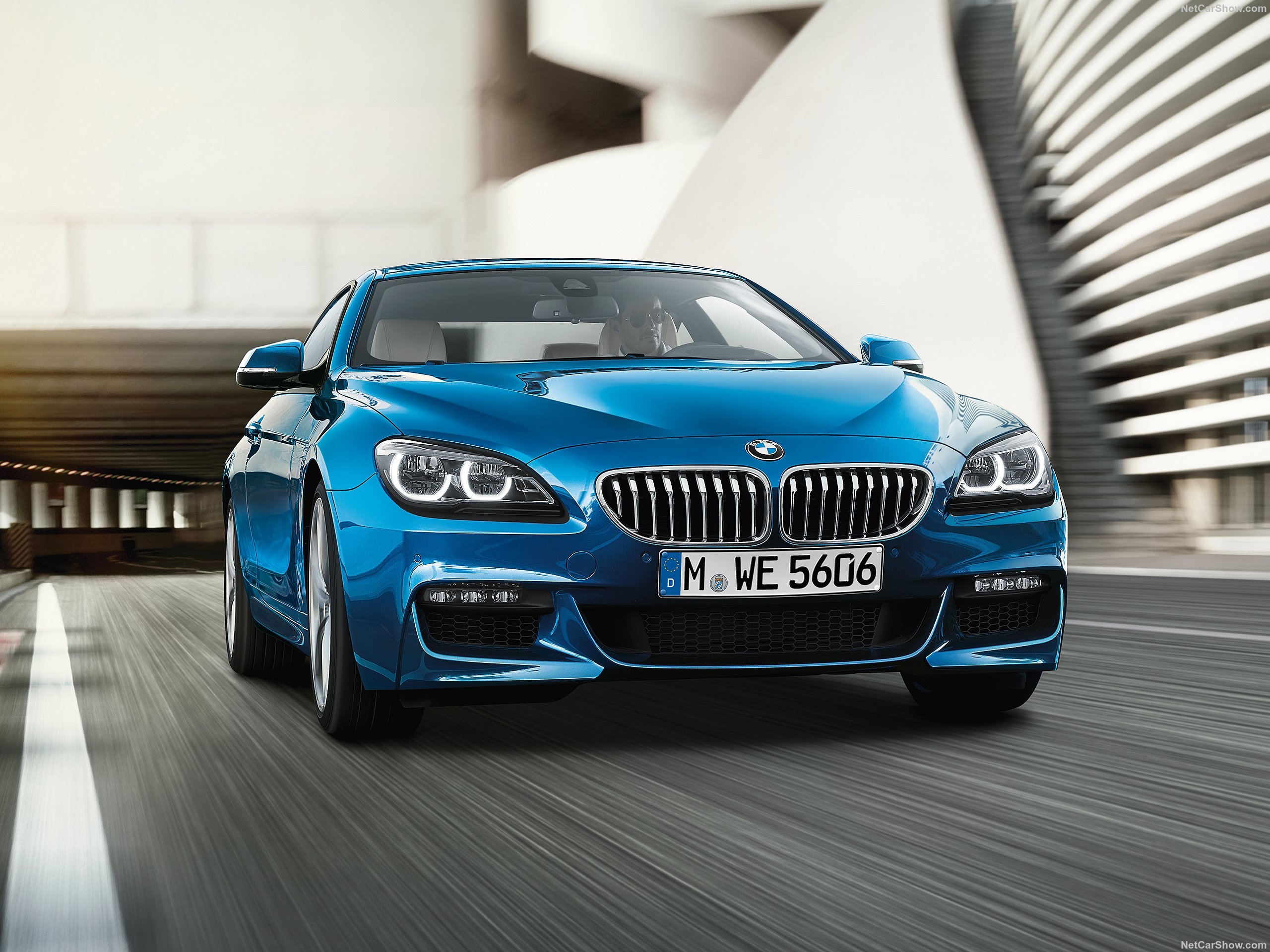 Blue BMW 6 Series driving on a road HD Wallpaper