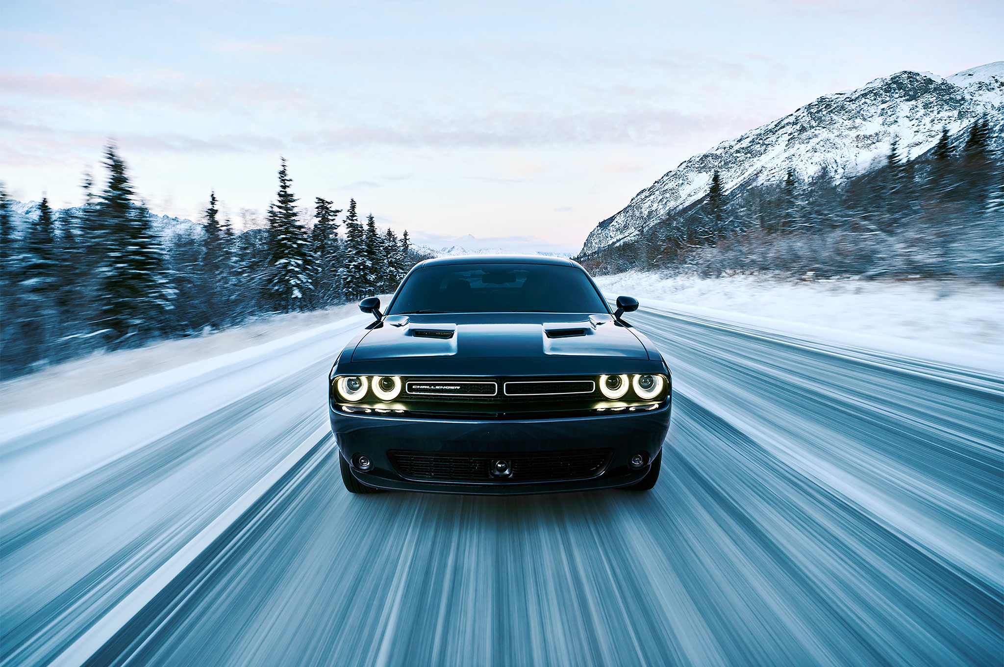 2017 Dodge Challenger GT AWD driving on snowy road HD Wallpaper