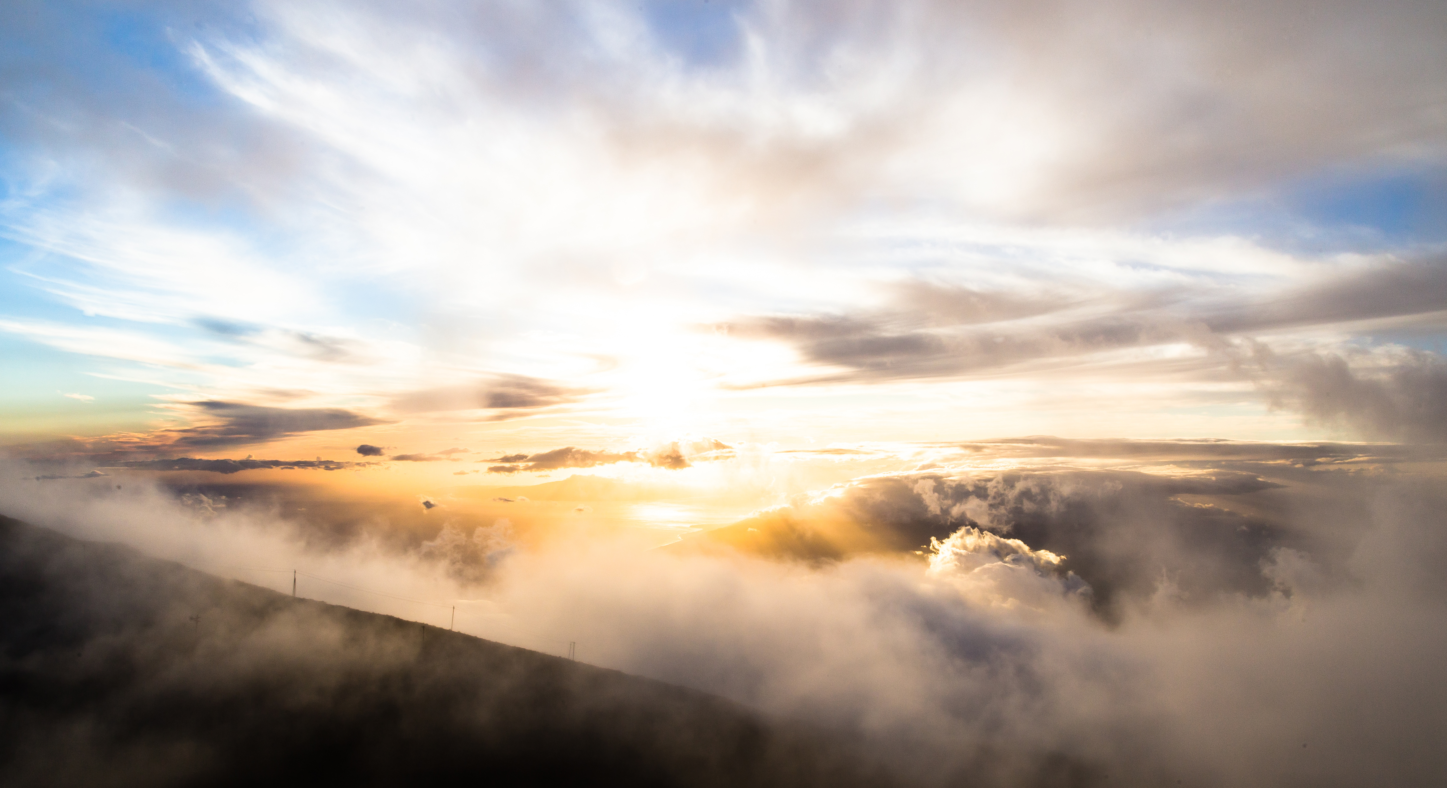 Sunrise over clouds with fog on mountain HD Wallpaper
