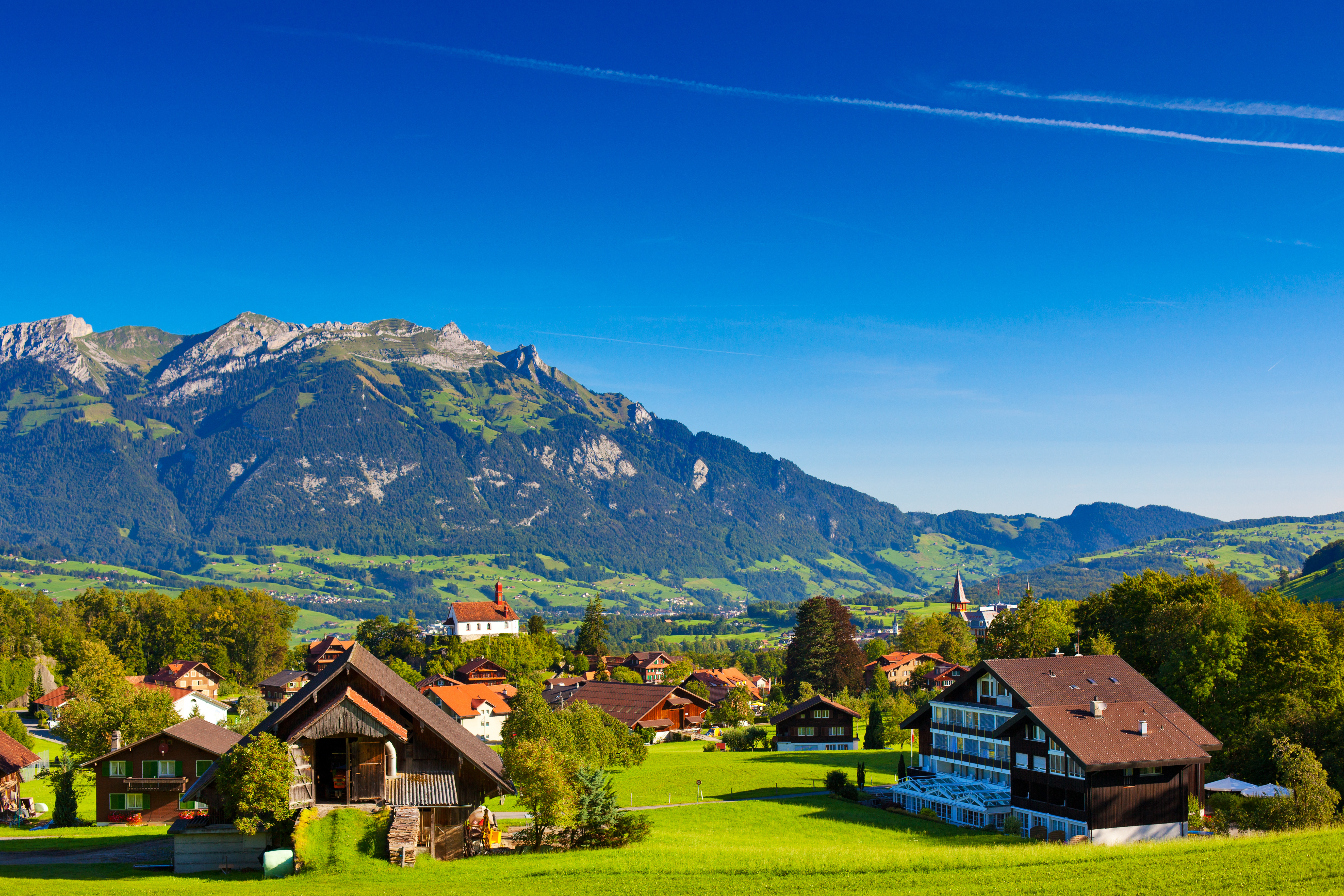 Village in the Swiss Alps with Mountains HD Wallpaper