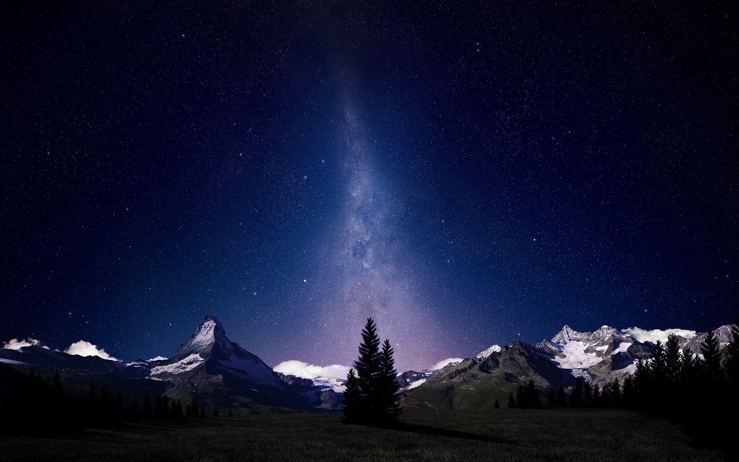 Milky Way over snow-capped mountains and pine trees HD Wallpaper