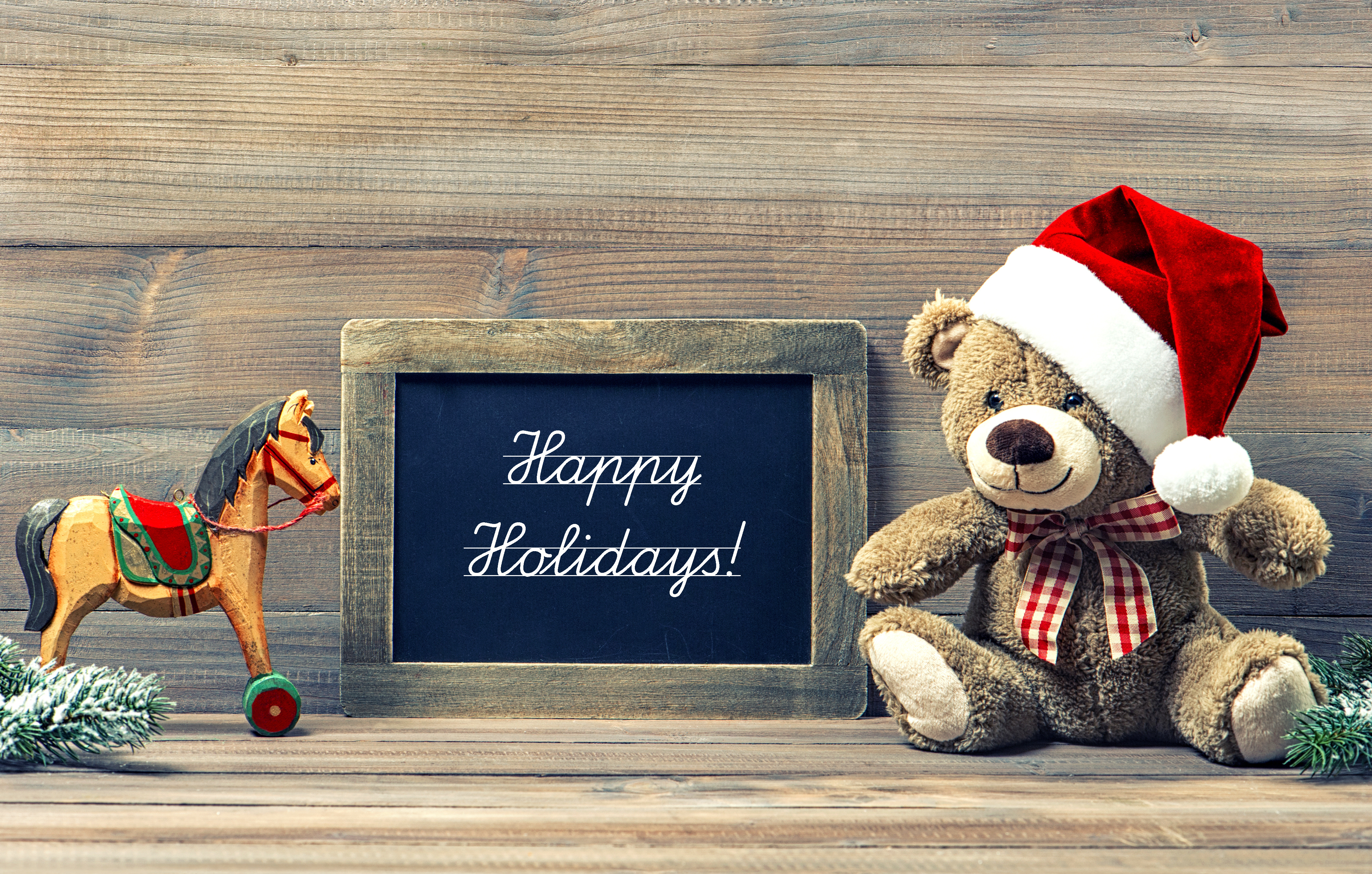 Teddy bear and toy horse with Happy Holidays sign HD Wallpaper