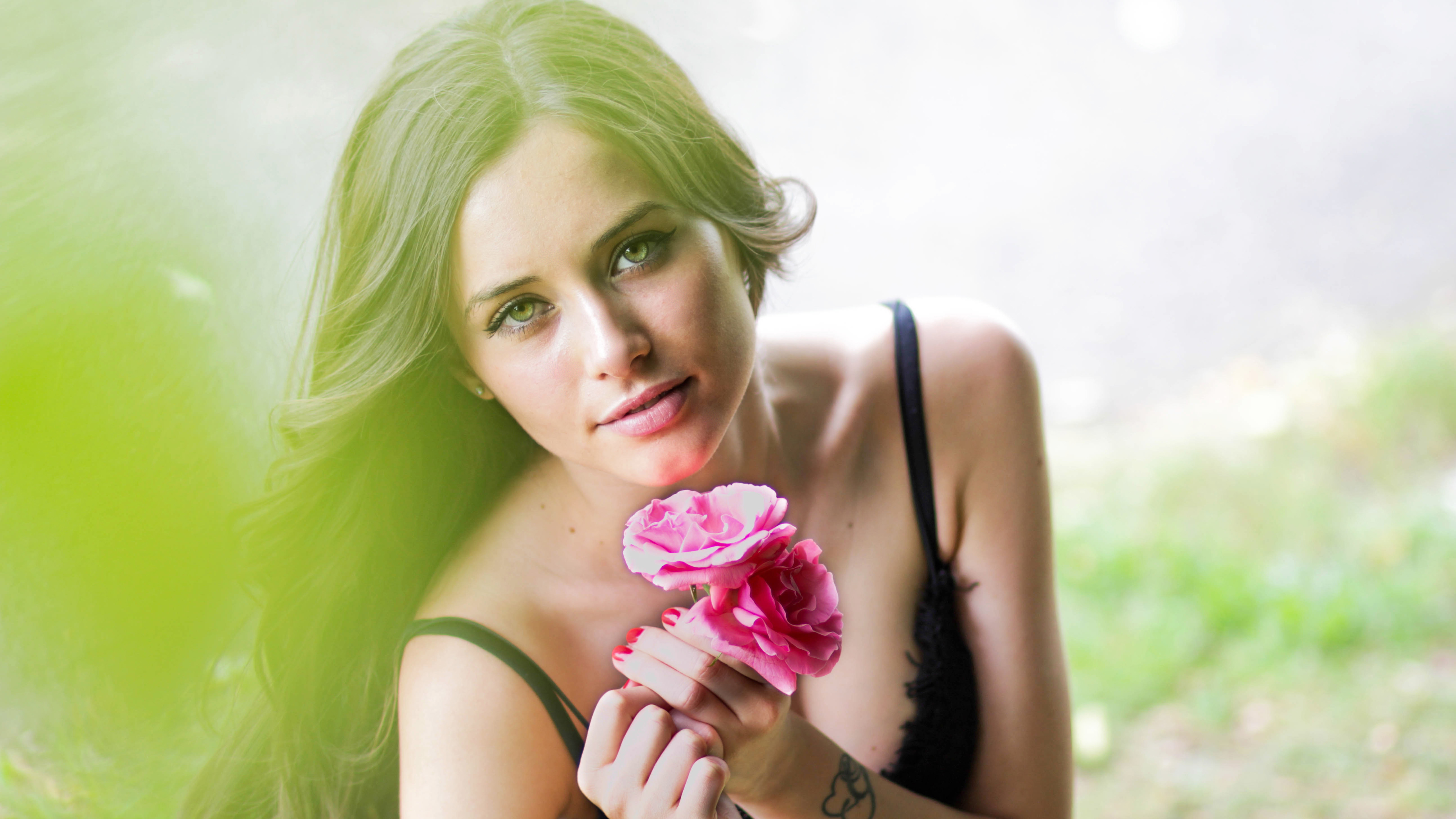 Woman holding pink roses HD Wallpaper