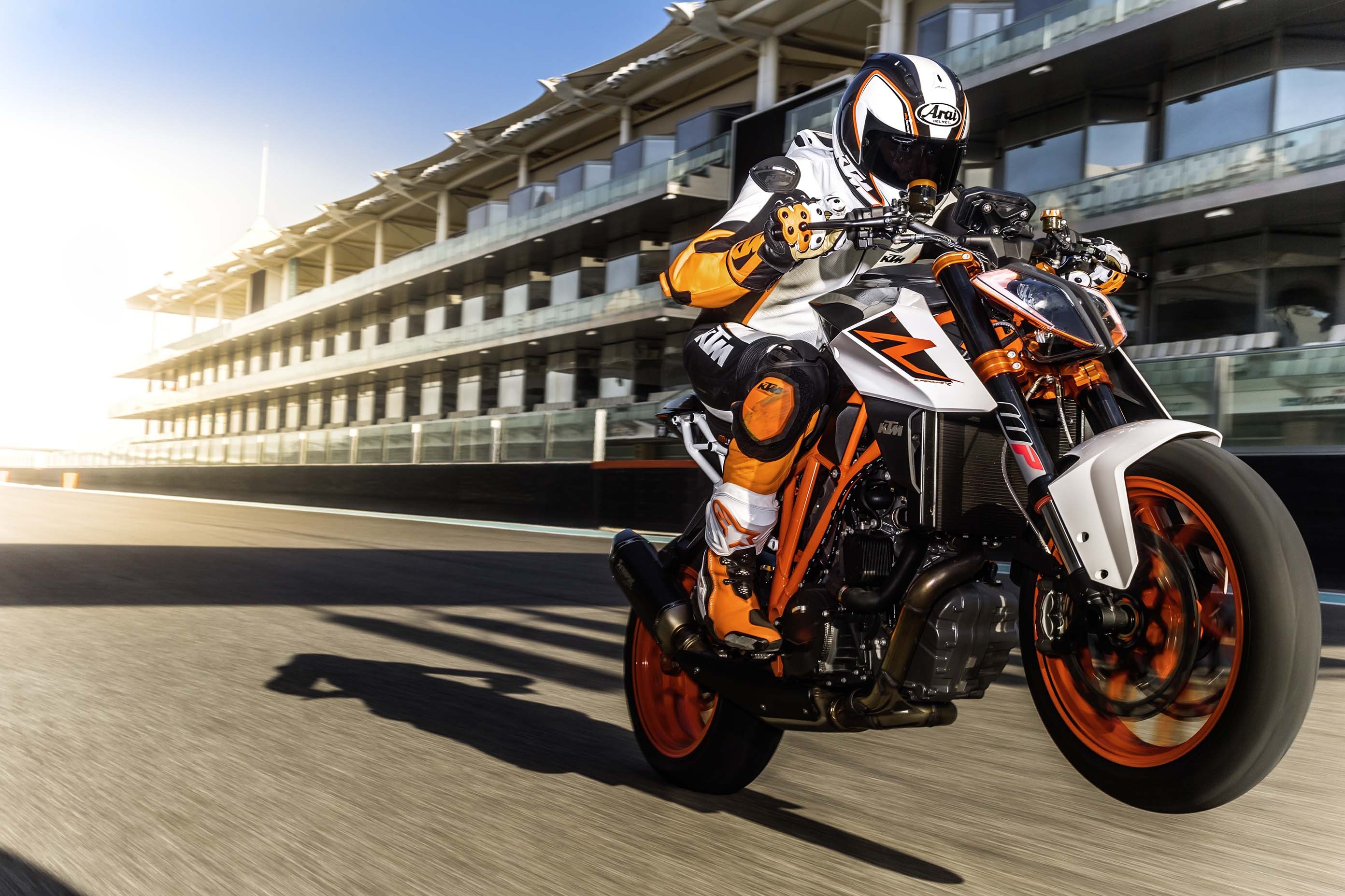KTM 1290 Super Duke R motorcycle stunt on a race track HD Wallpaper