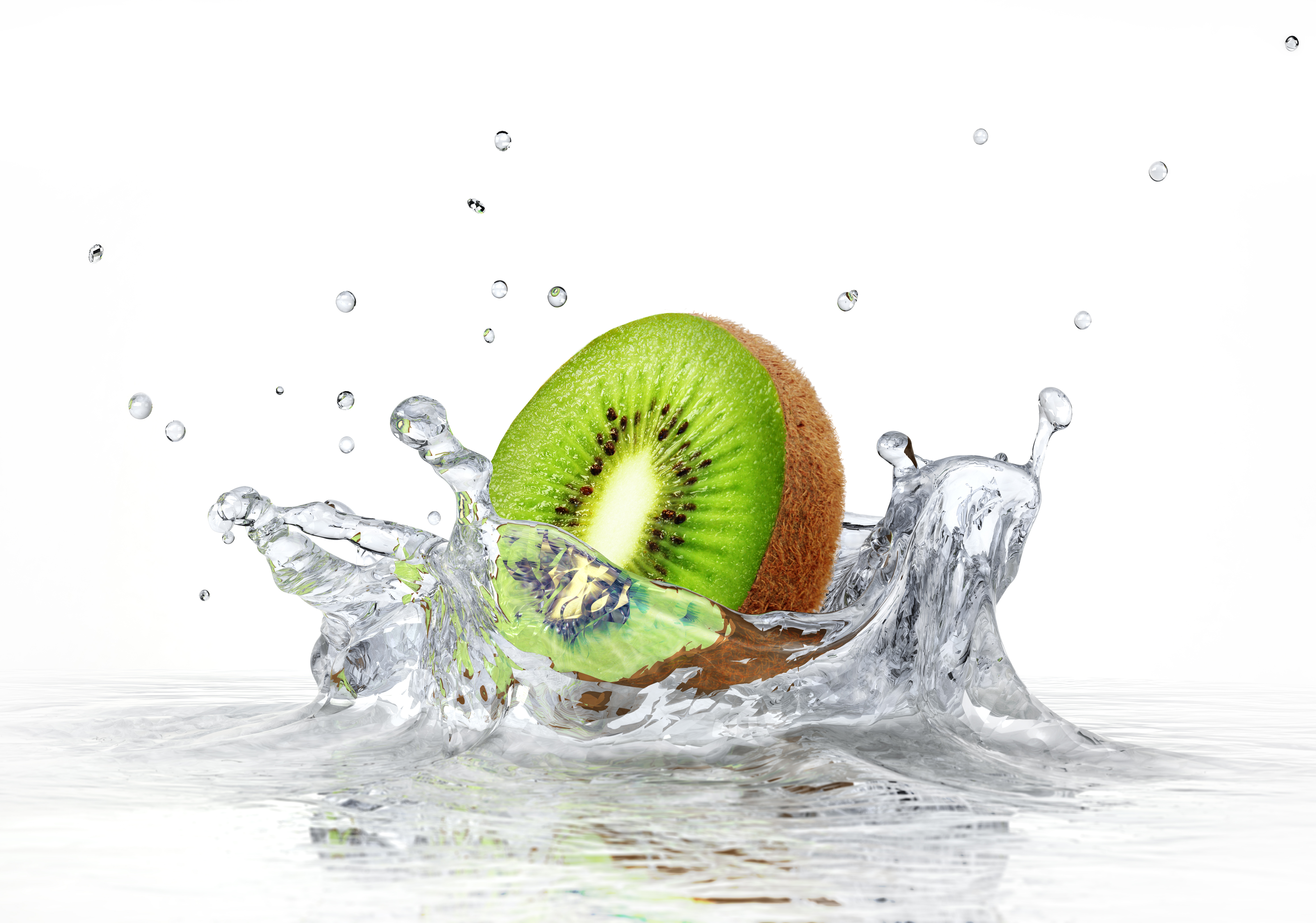 Kiwi fruit splashing in water HD Wallpaper