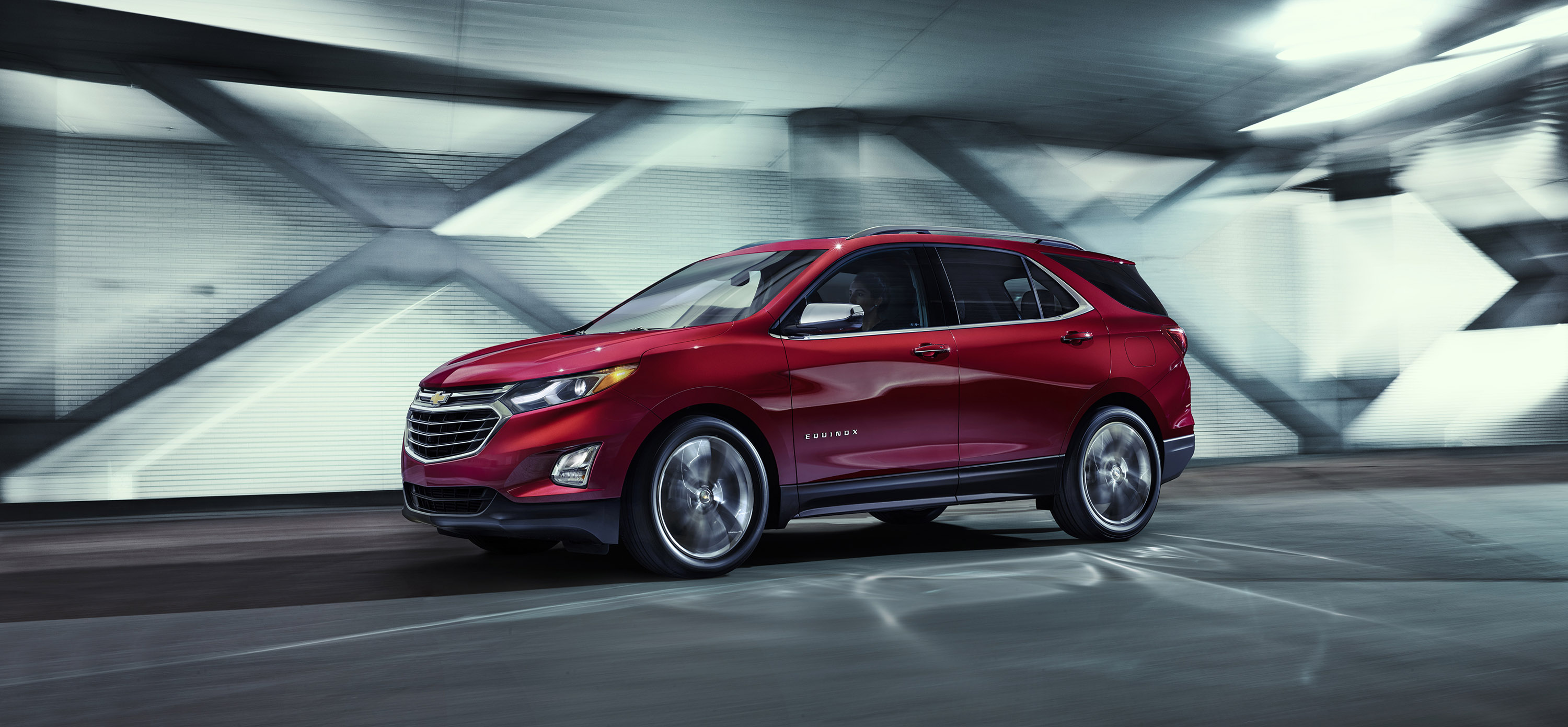 Red Chevrolet Equinox driving in a tunnel HD Wallpaper
