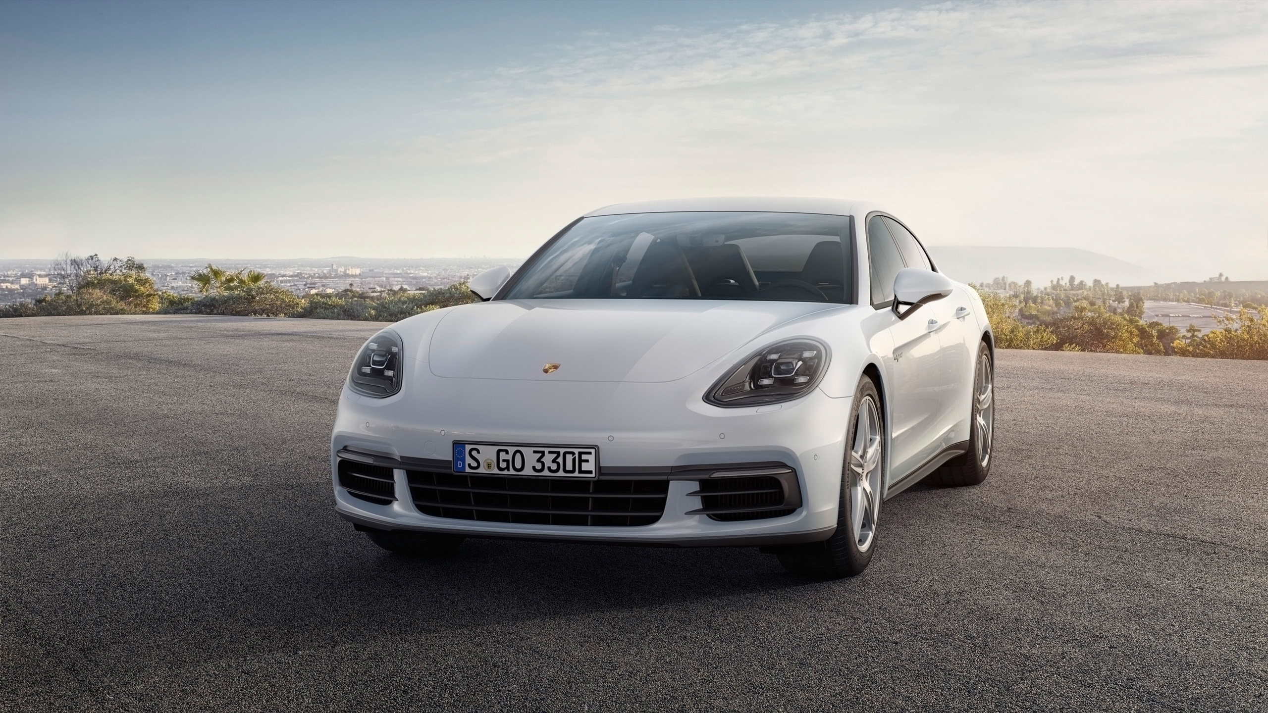 White Porsche Panamera 4 E-Hybrid parked outdoors HD Wallpaper