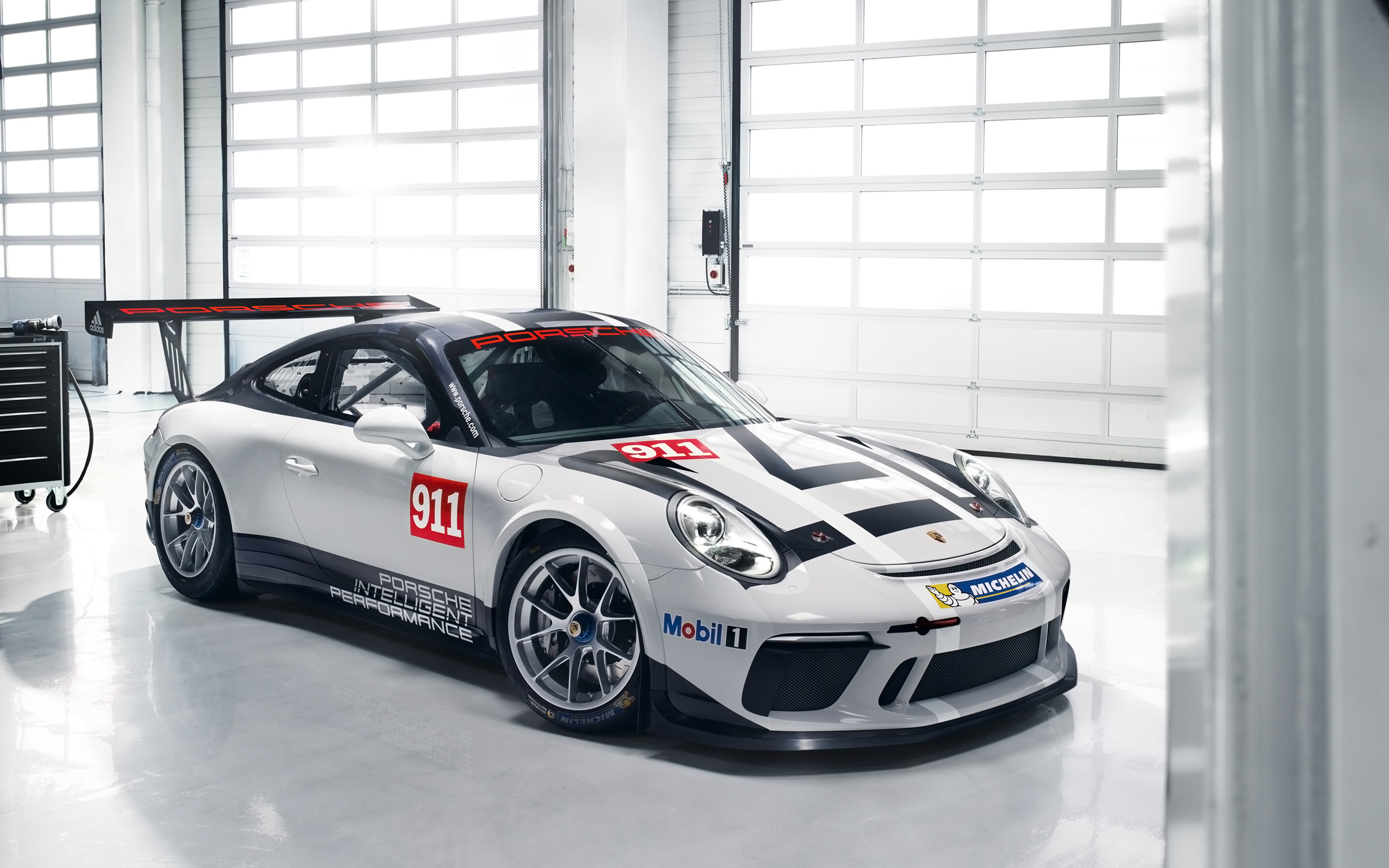 Porsche 911 GT3 Cup race car in a garage HD Wallpaper
