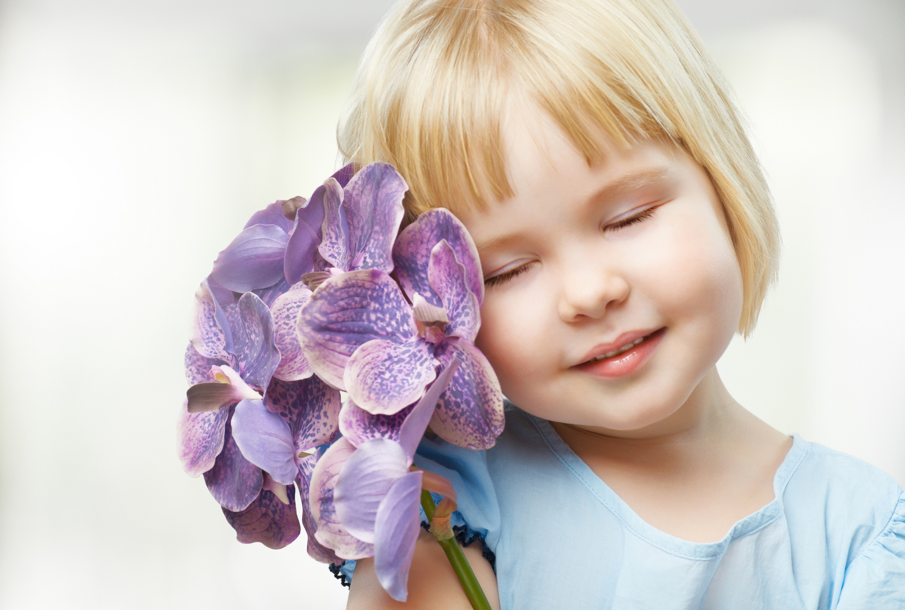 Cute girl with purple orchids HD Wallpaper