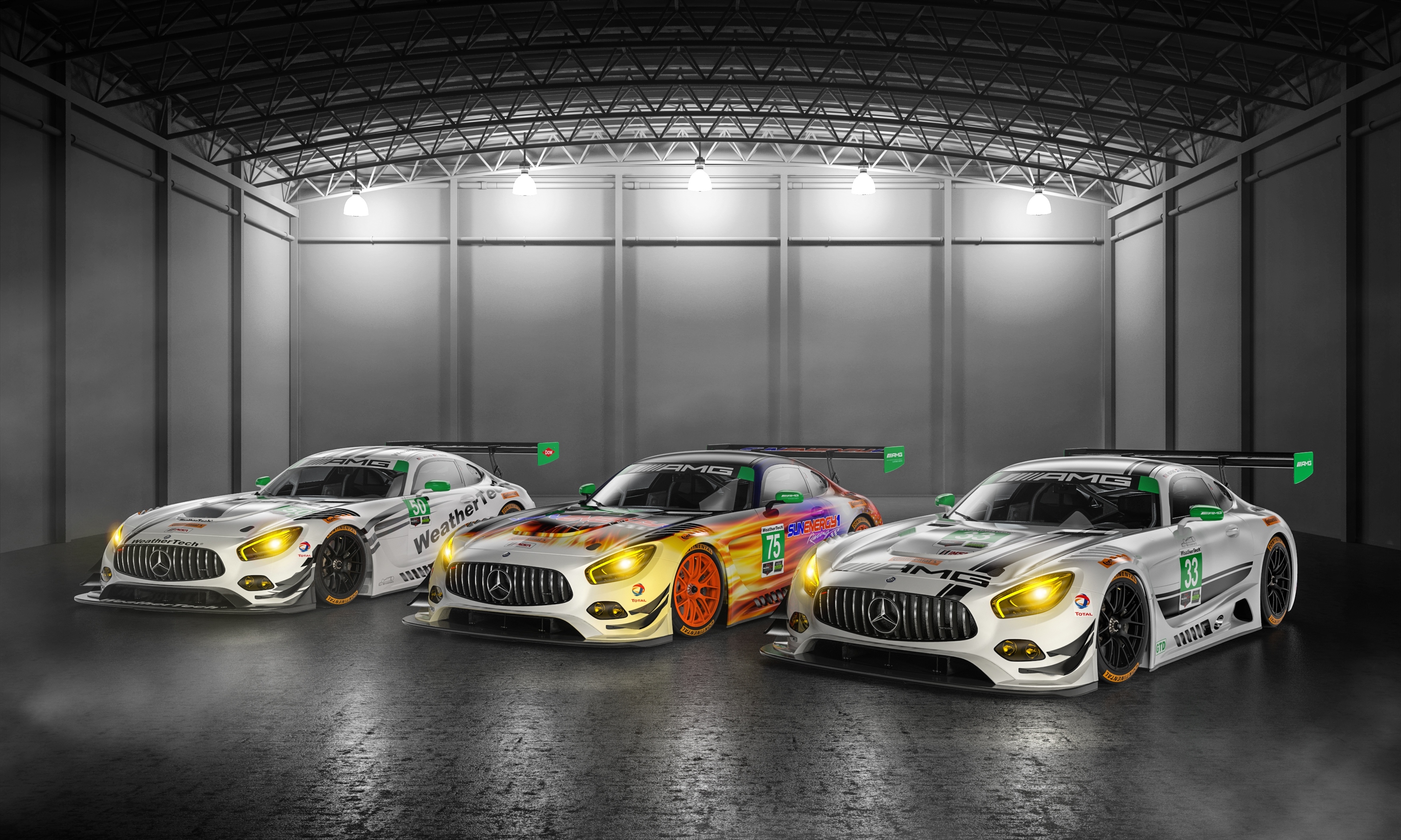 Three Mercedes-AMG GT3 race cars in a garage HD Wallpaper