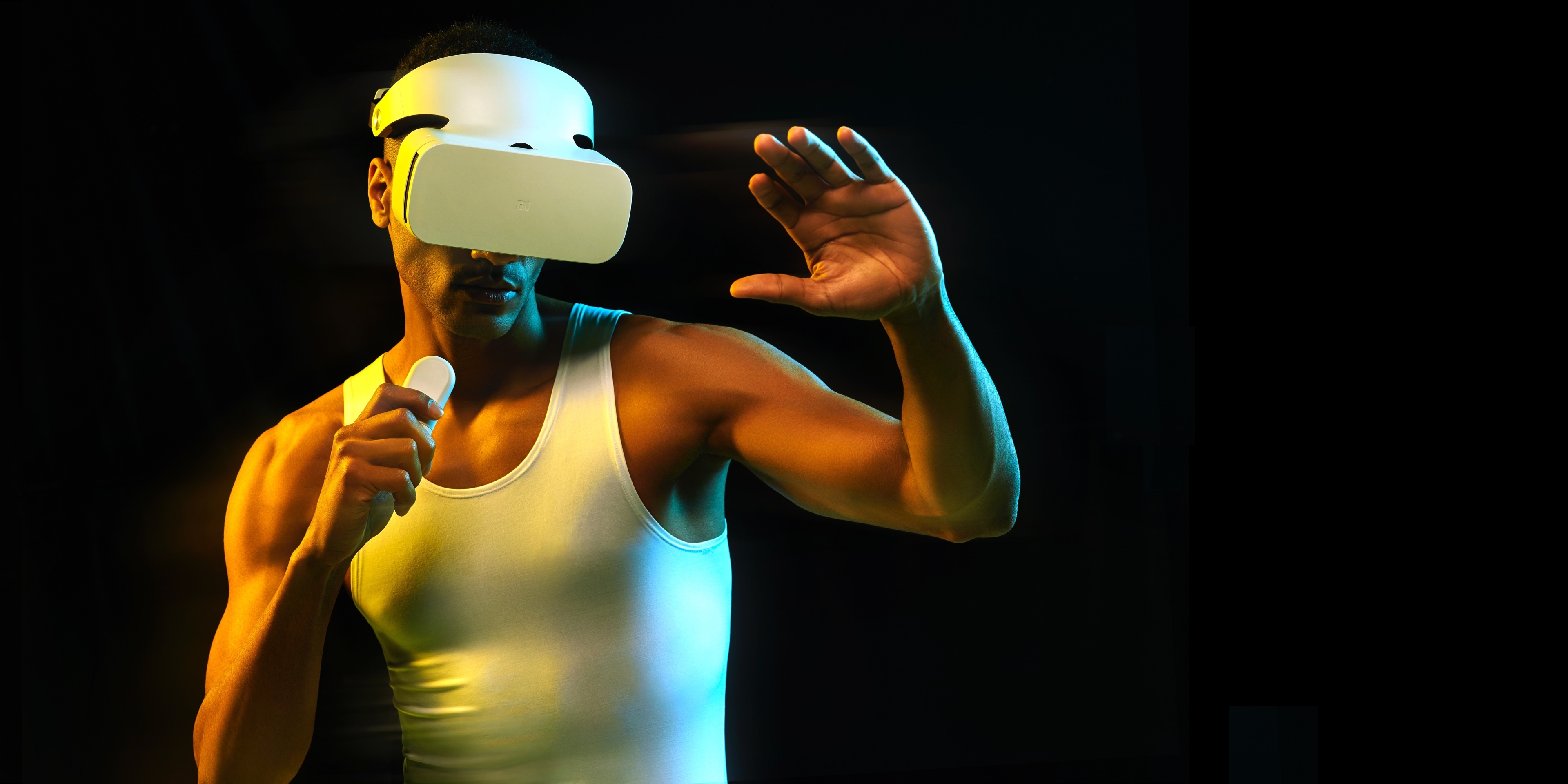Man wearing Xiaomi VR headset holding controller HD Wallpaper
