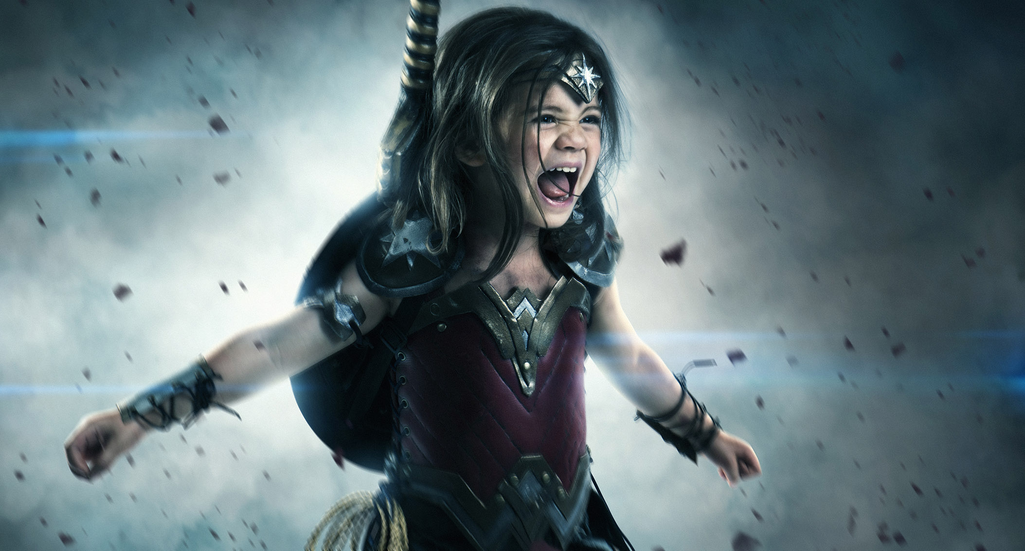 Young girl dressed as Wonder Woman in battle HD Wallpaper