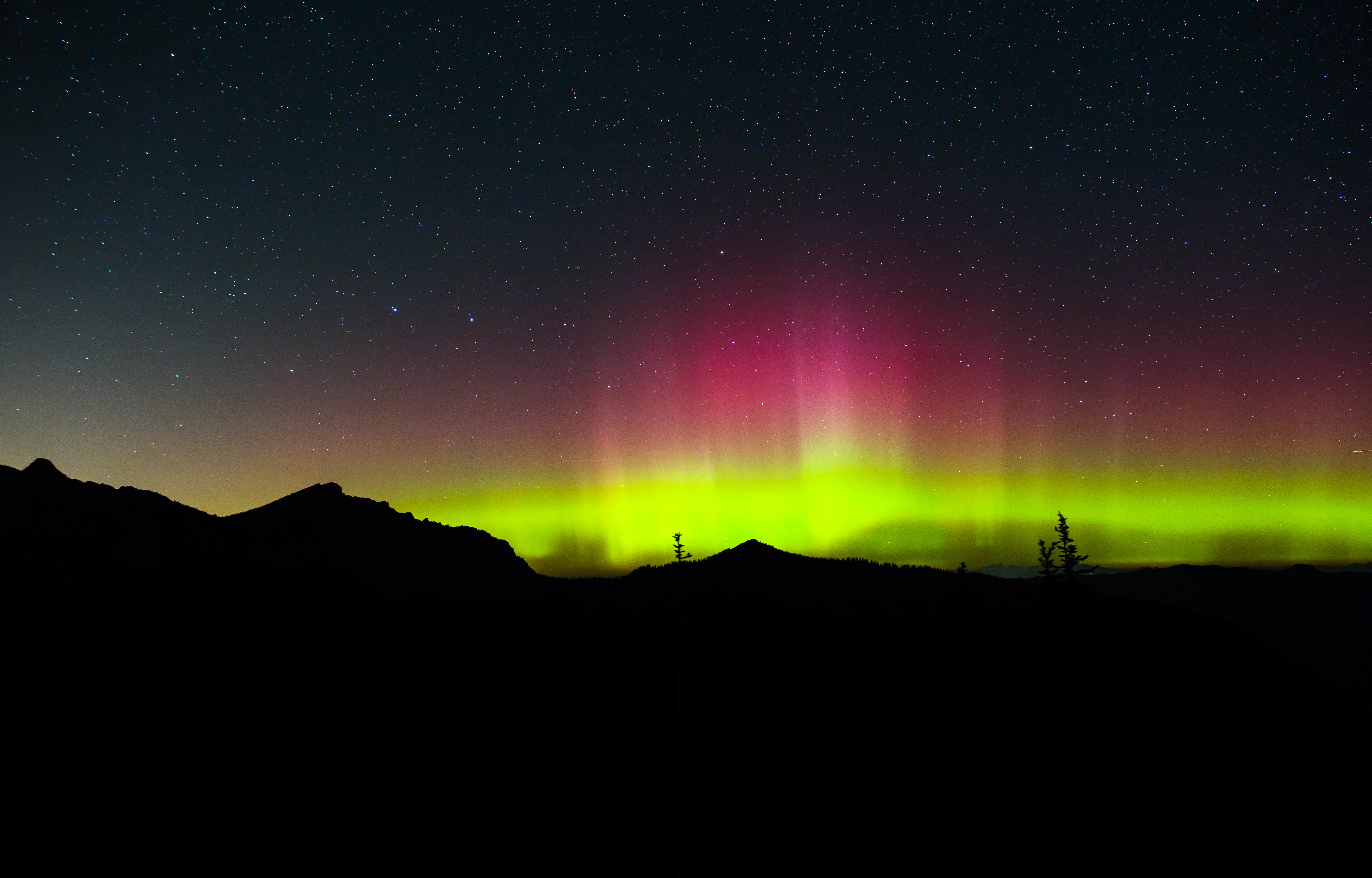 Aurora Borealis Over Mountain Silhouettes HD Wallpaper