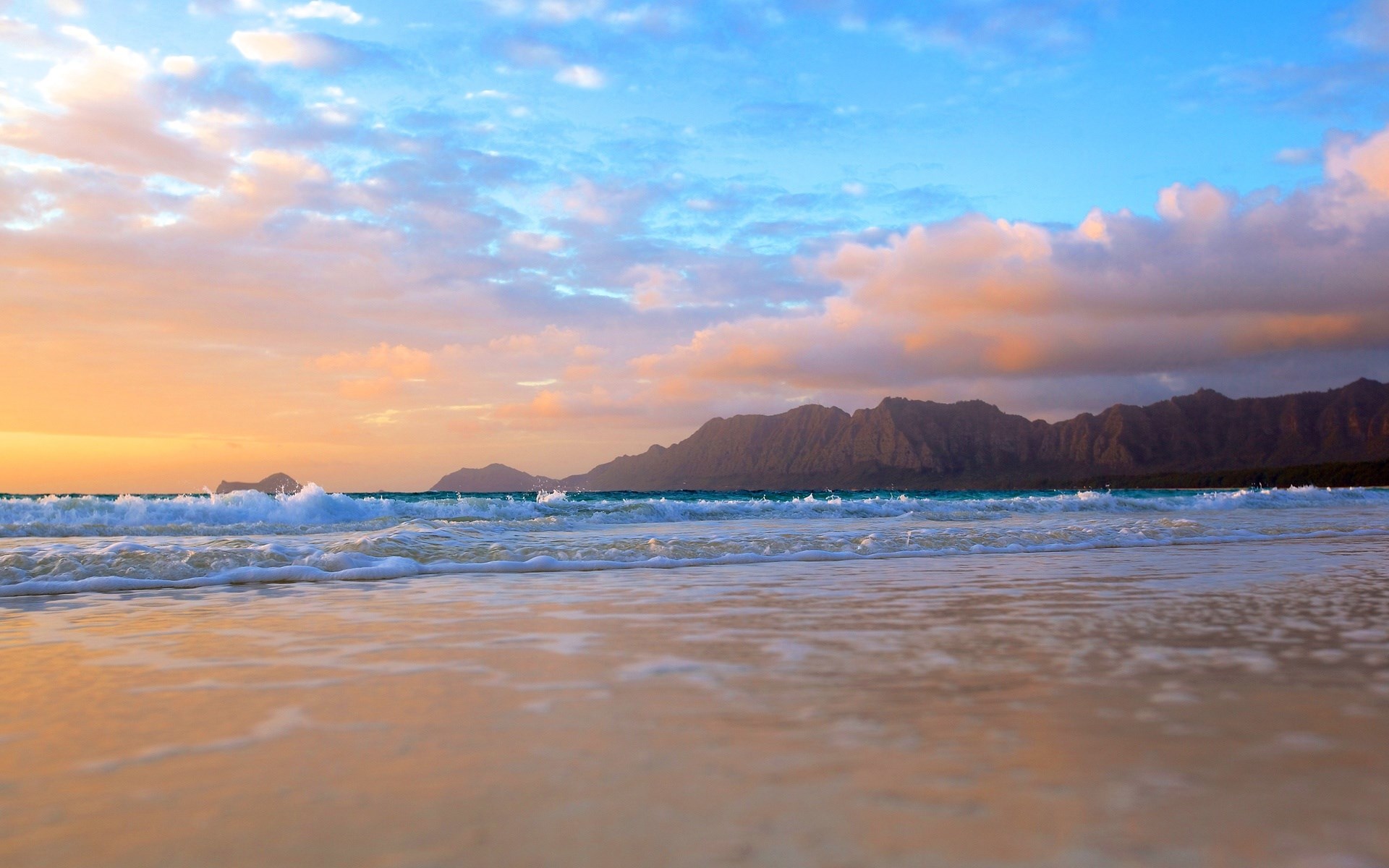 Beach with mountains and ocean waves at sunset HD Wallpaper
