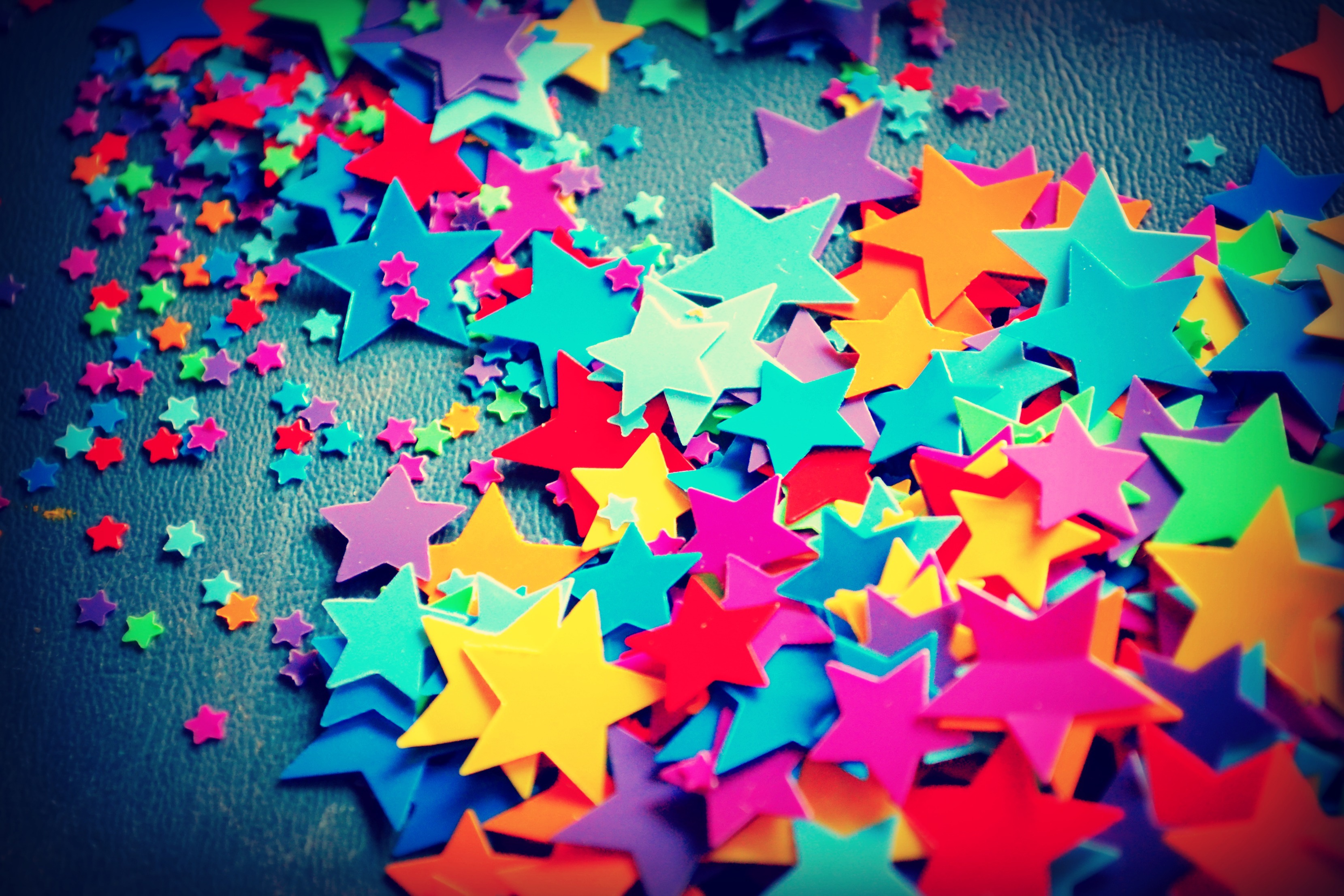 Scattered colorful star confetti HD Wallpaper