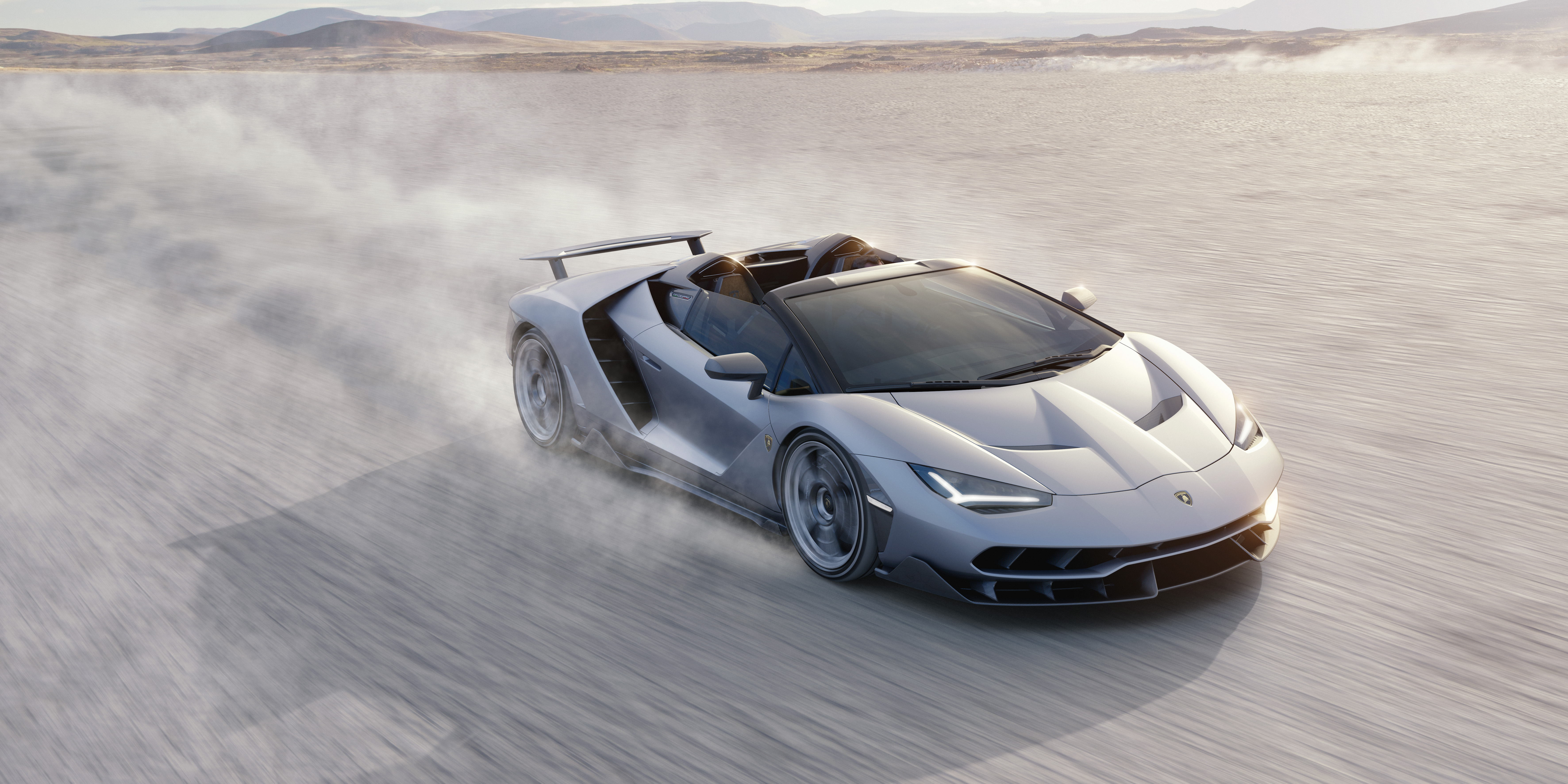 Lamborghini Centenario Roadster drifting in dust HD Wallpaper