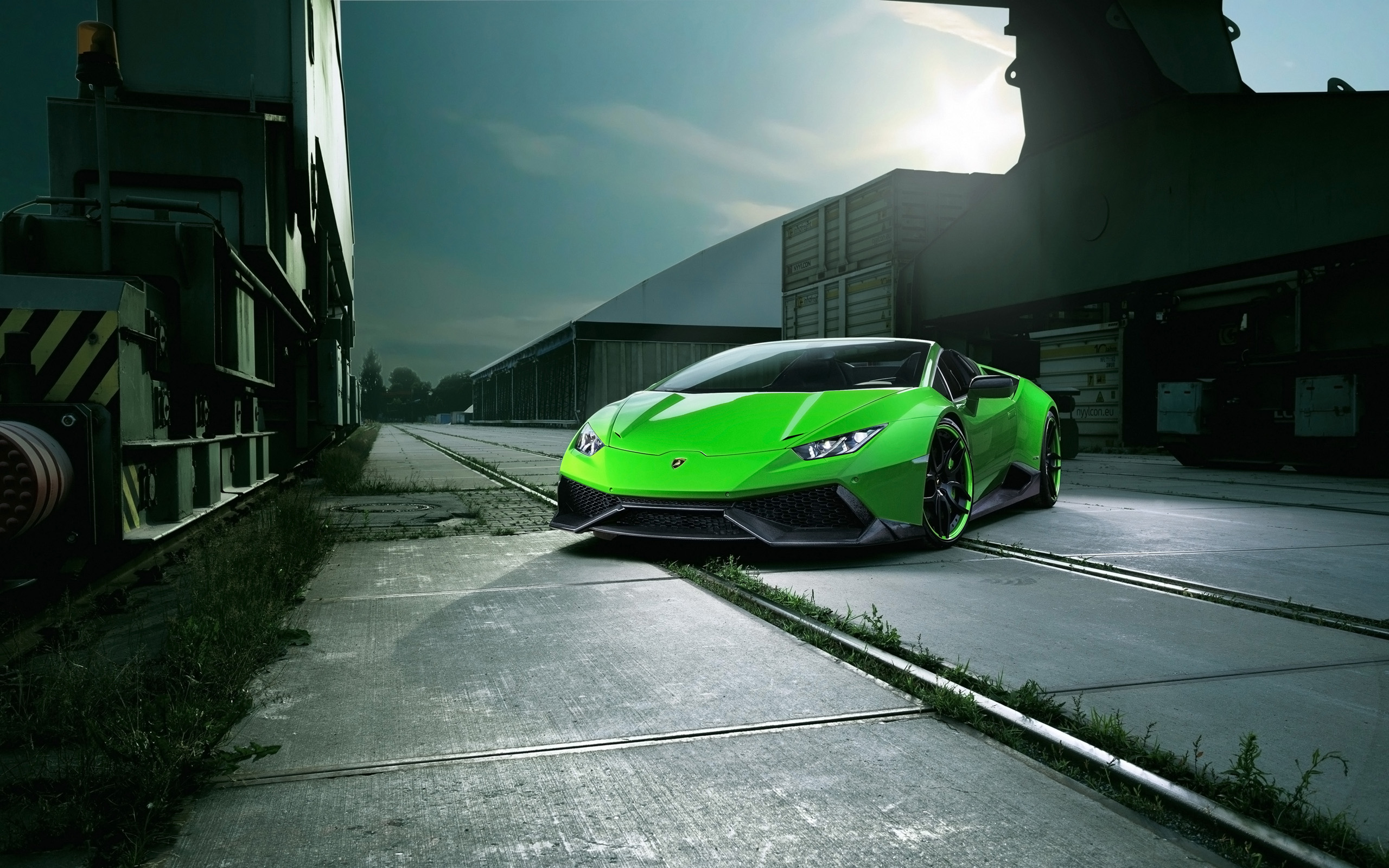 Green Lamborghini Huracan Spyder parked on train tracks HD Wallpaper
