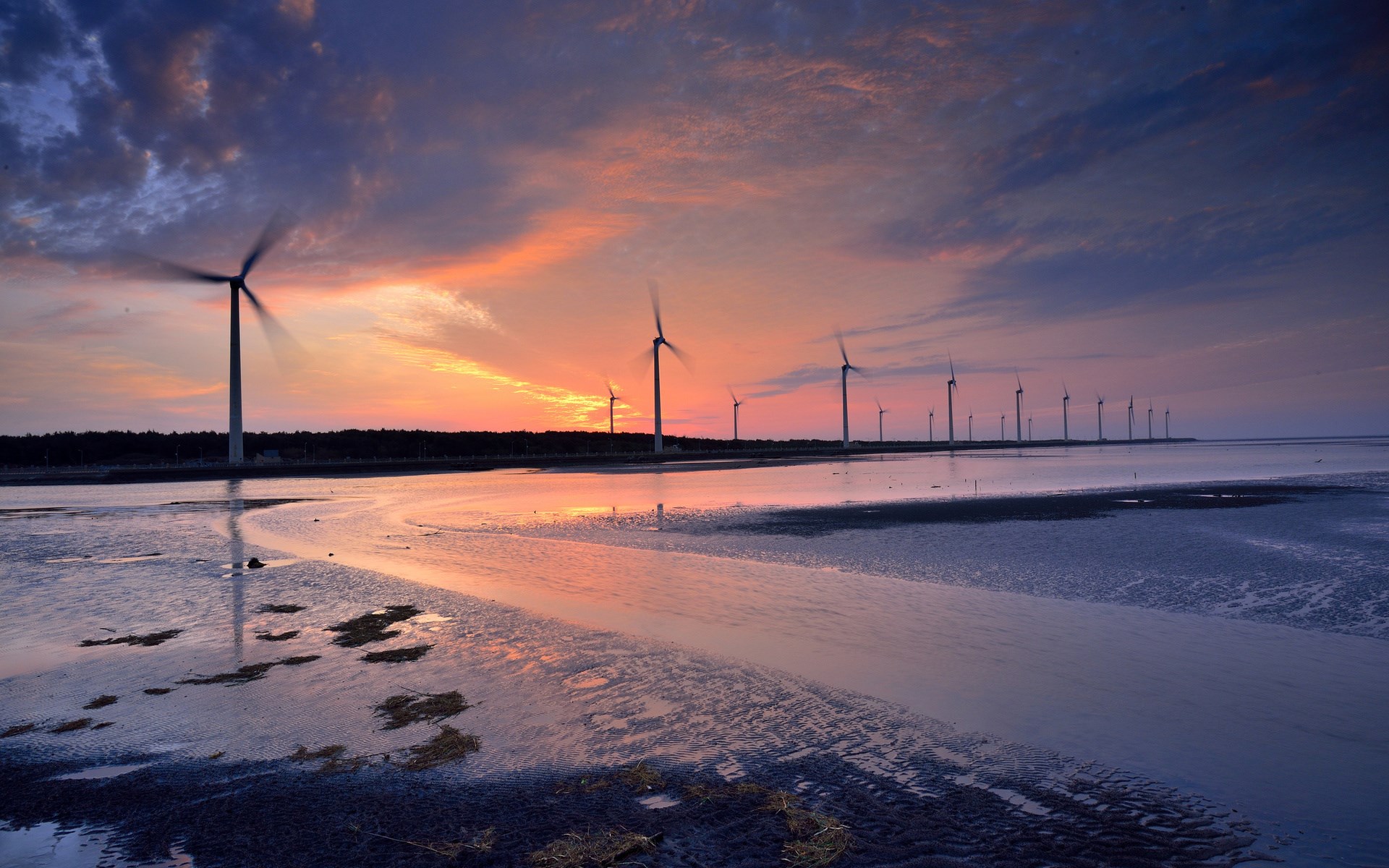 Wind turbines at sunset over a tidal flat HD Wallpaper