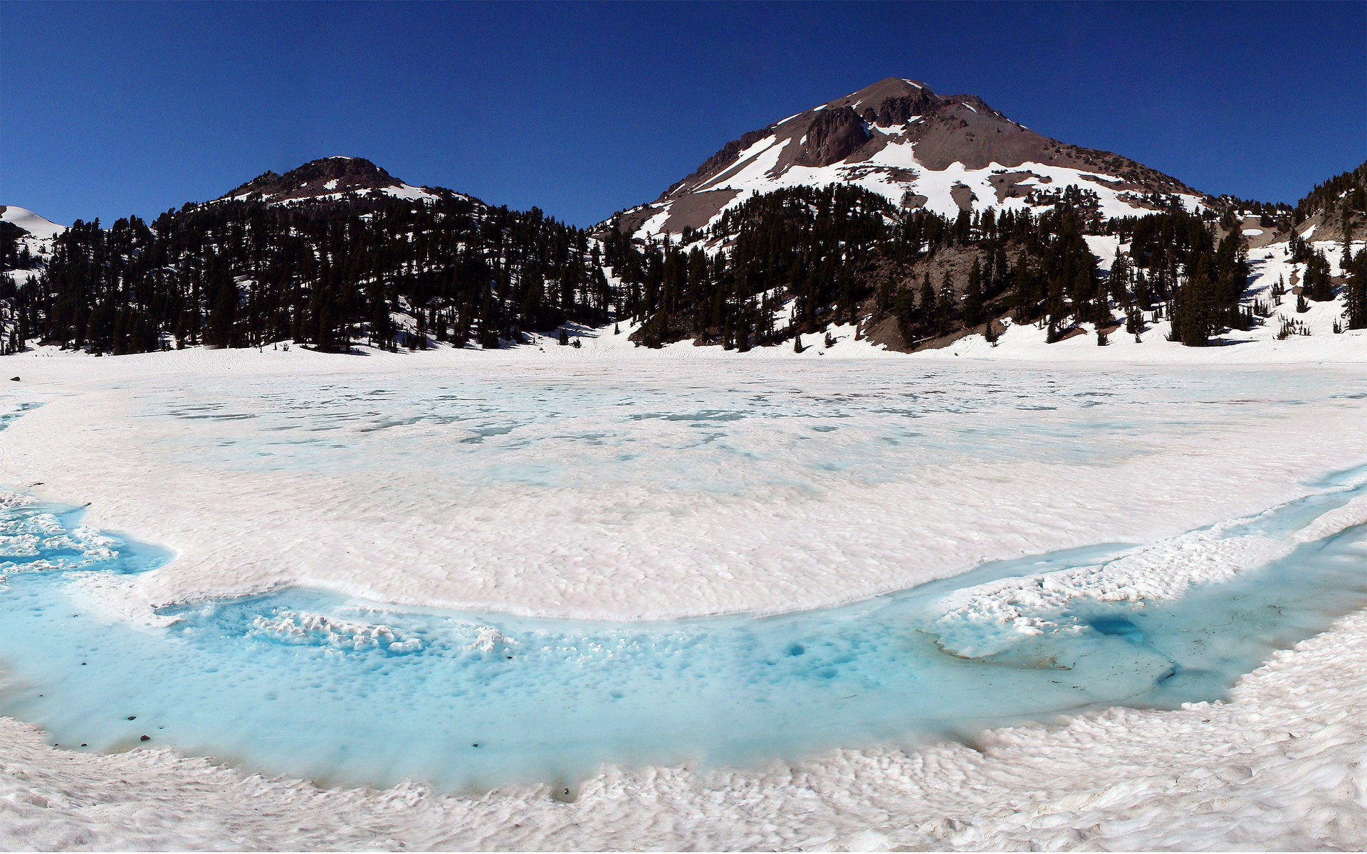 Frozen lake with mountains and pine trees HD Wallpaper