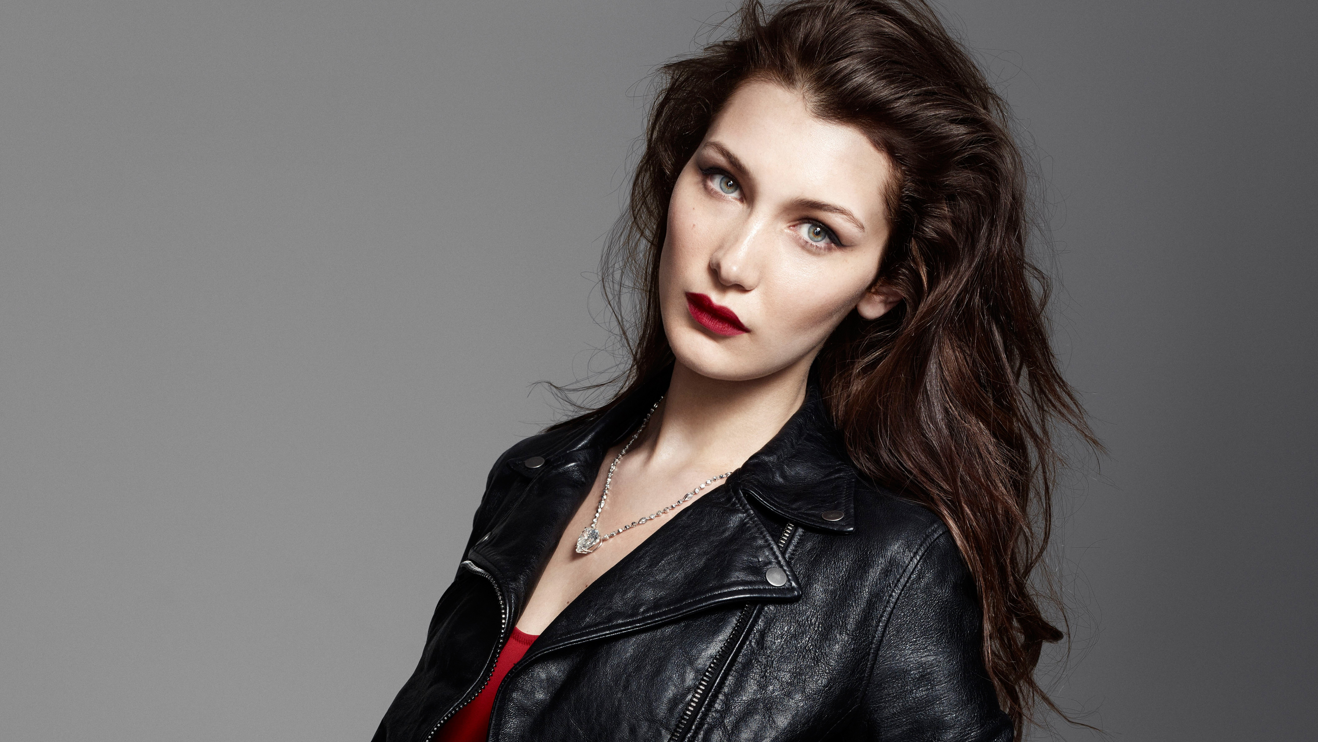 Bella Hadid wearing a black leather jacket HD Wallpaper