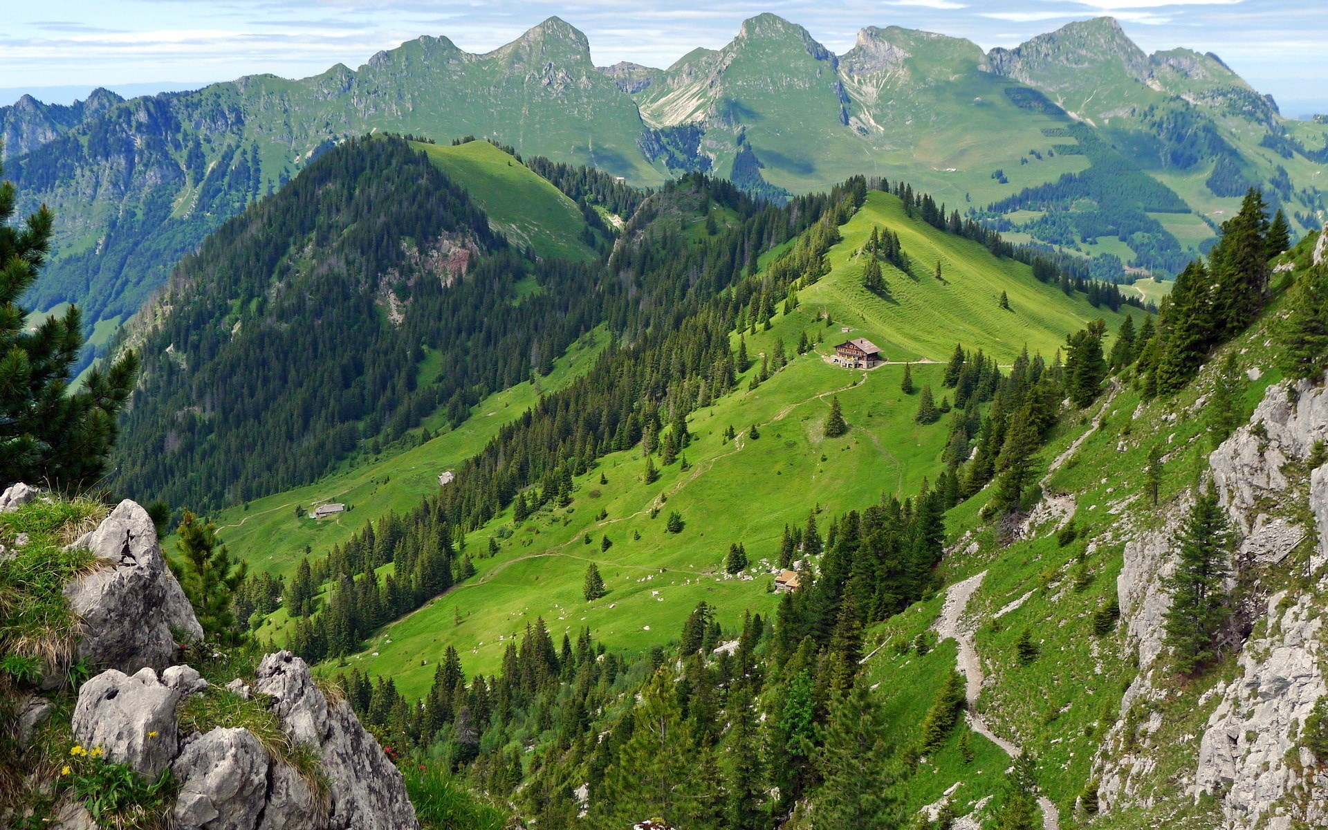 Green mountain landscape with houses and trees HD Wallpaper