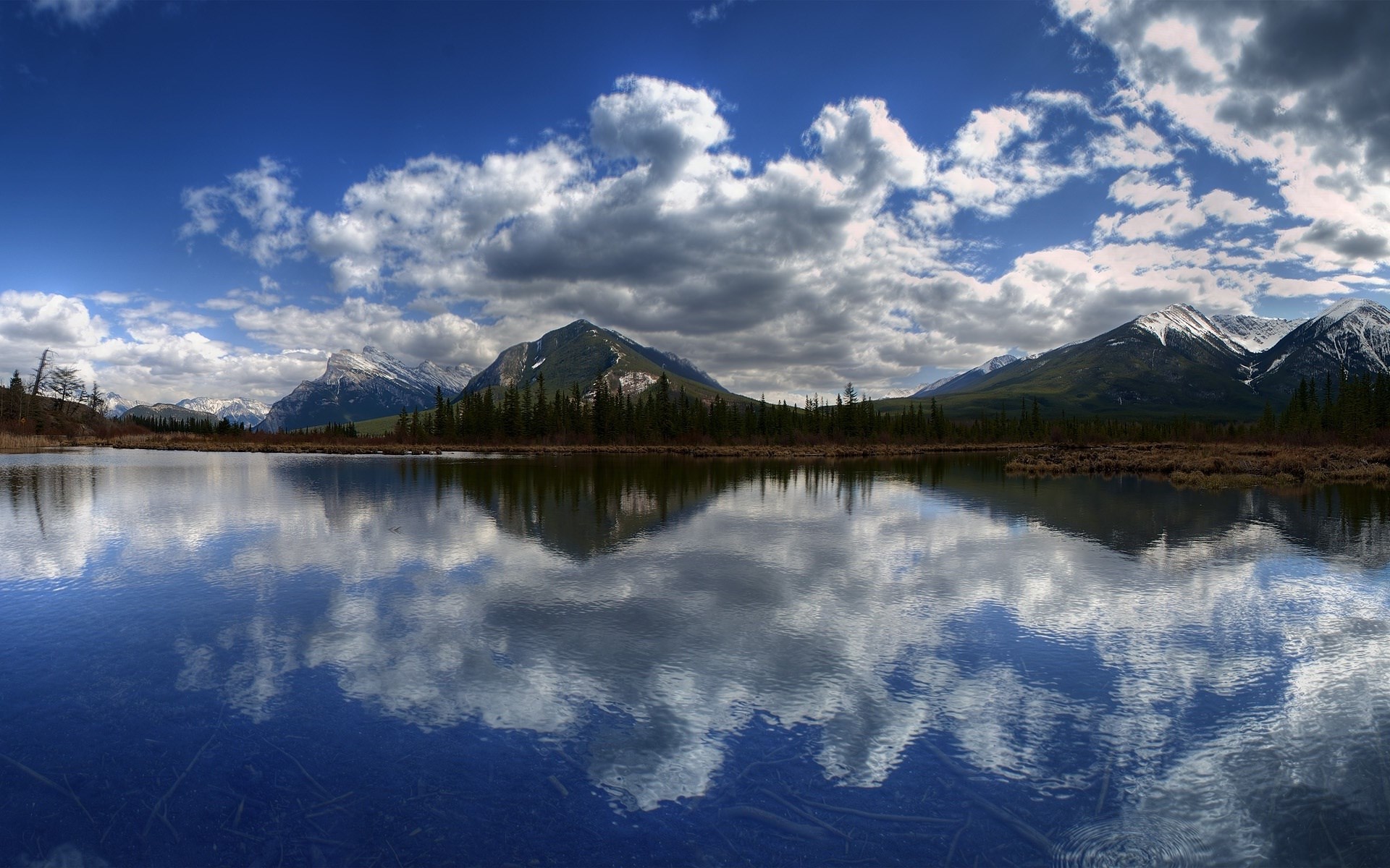 Mountain lake reflection with clouds and snow-capped peaks HD Wallpaper
