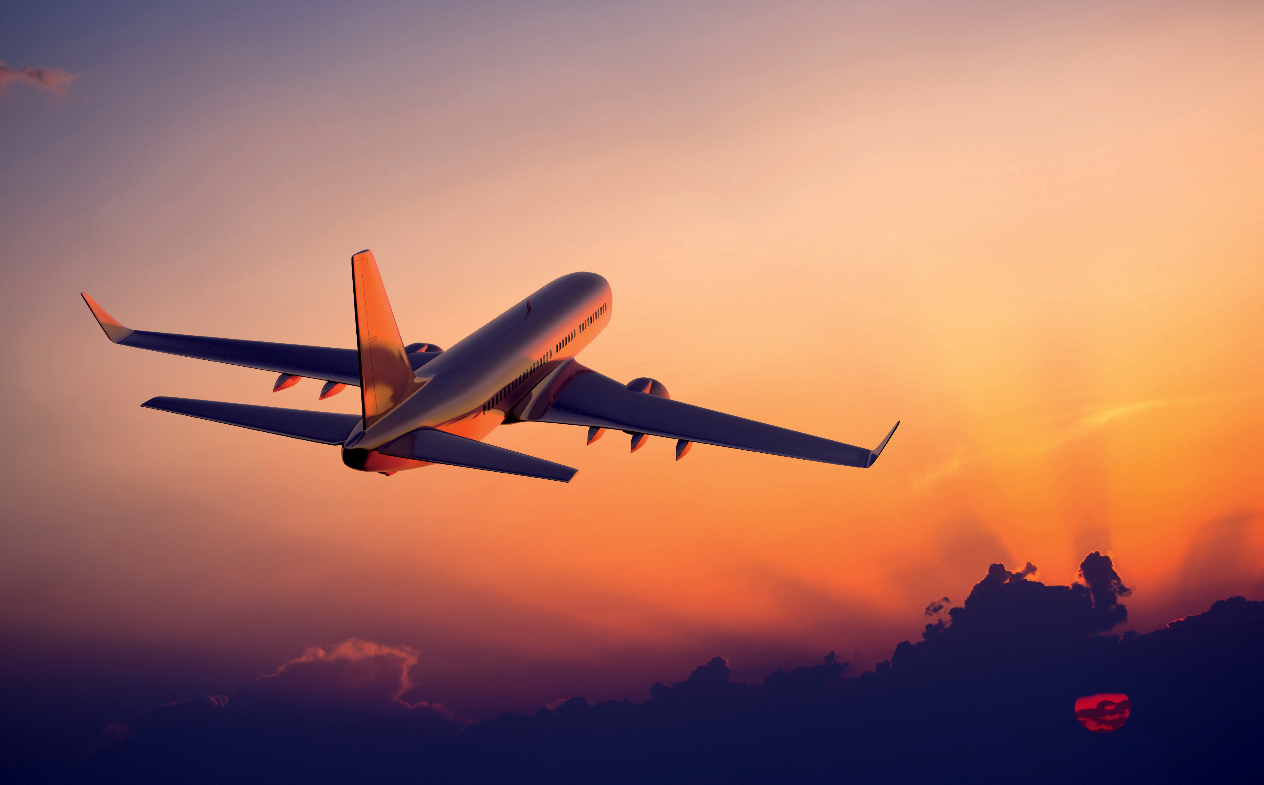 Airplane flying at sunset HD Wallpaper